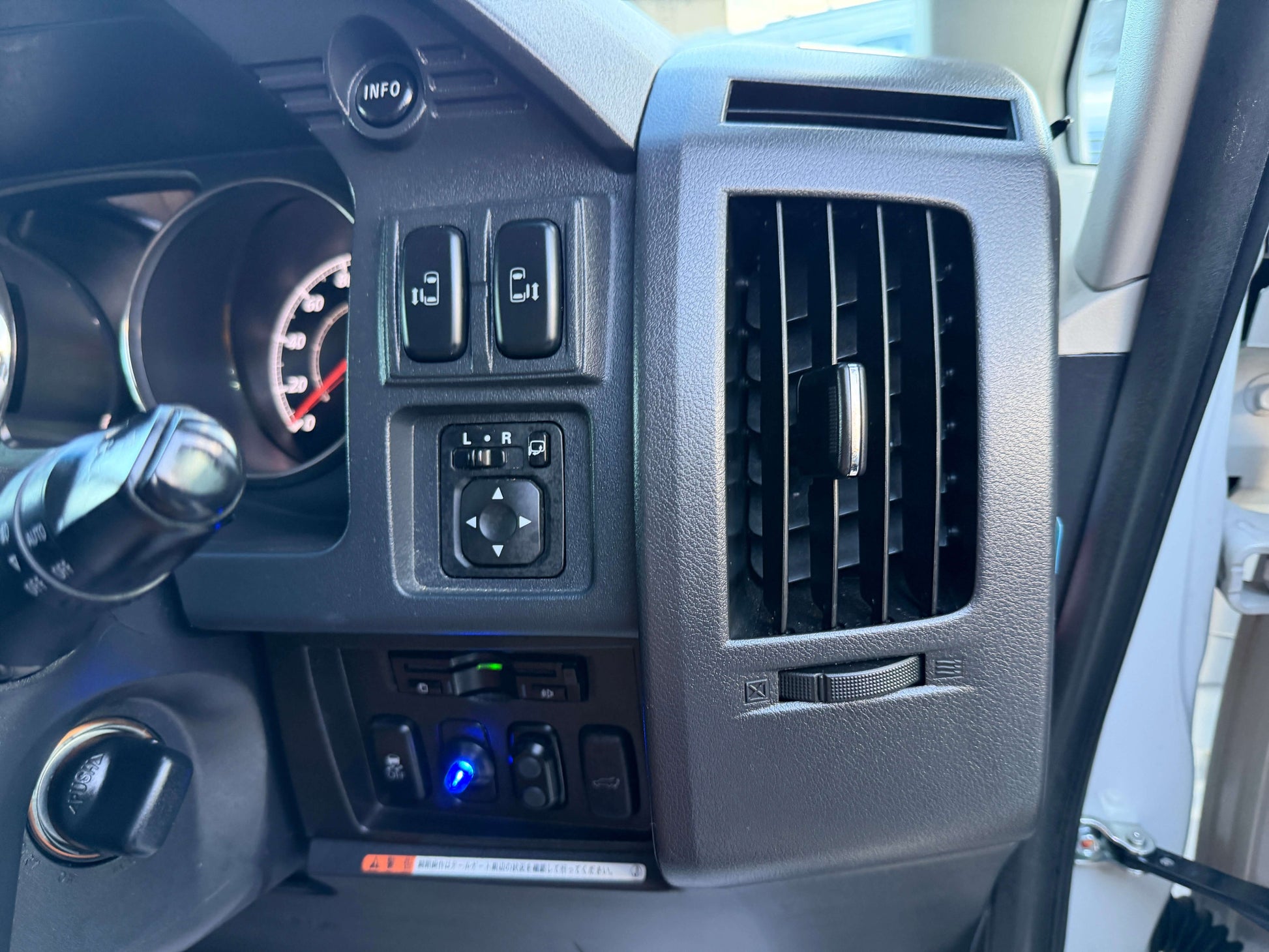 Interior control panel of a 2017 Mitsubishi Delica D5 2.3 Diesel-Turbo 4WD showing switches and air vents.