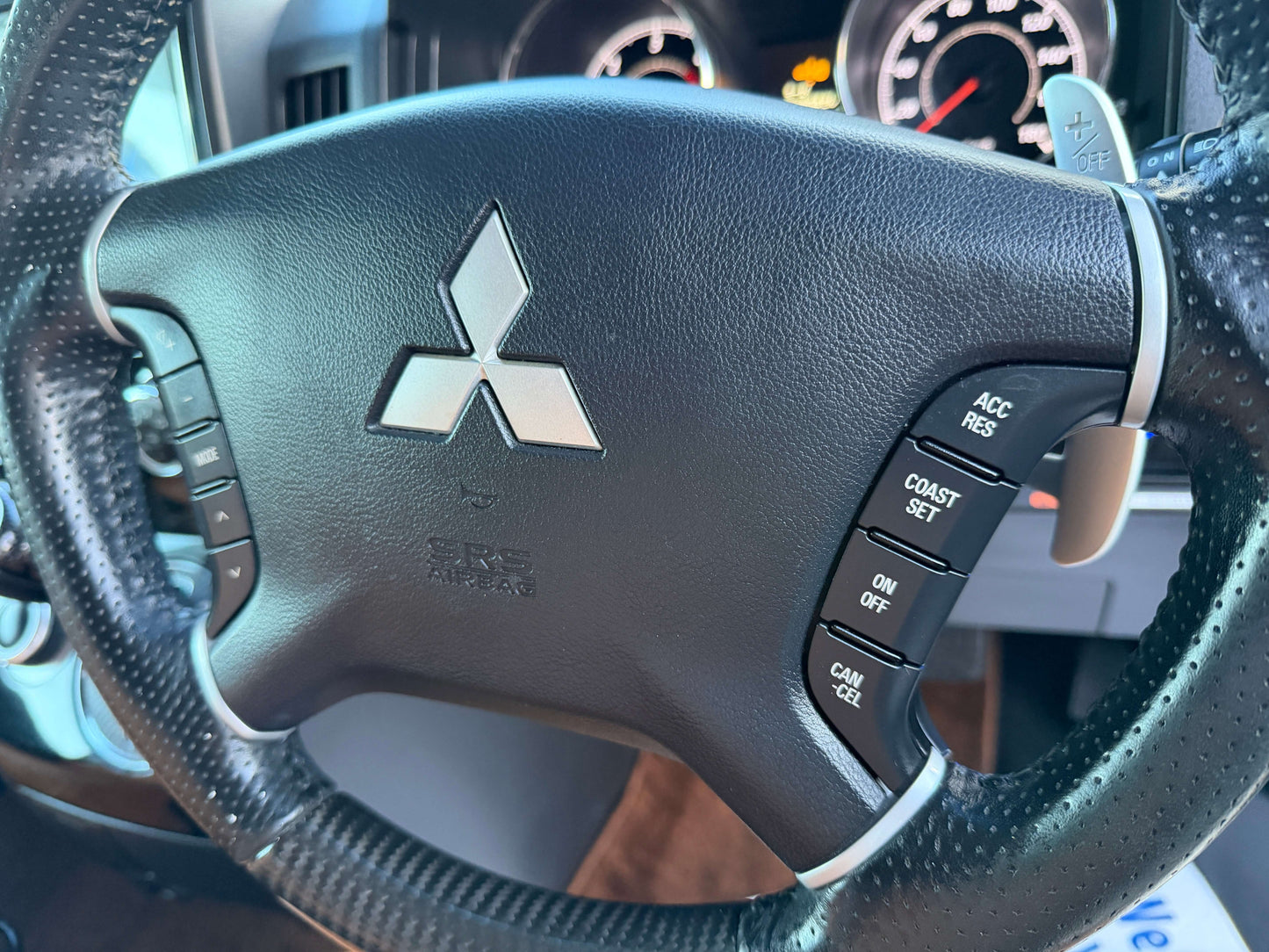 2017 Mitsubishi Delica D5 2.3 Diesel-Turbo 4WD steering wheel controls and logo close-up