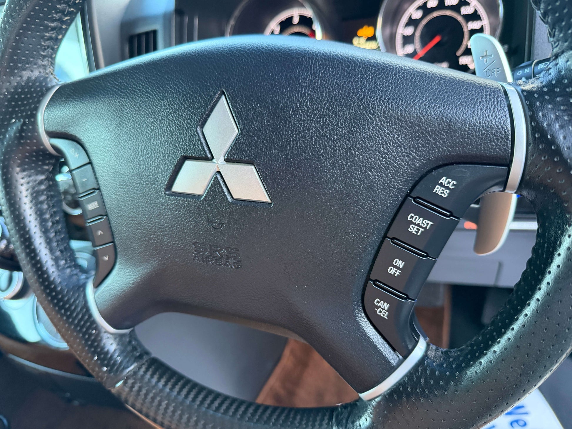 2017 Mitsubishi Delica D5 2.3 Diesel-Turbo 4WD steering wheel controls and logo close-up