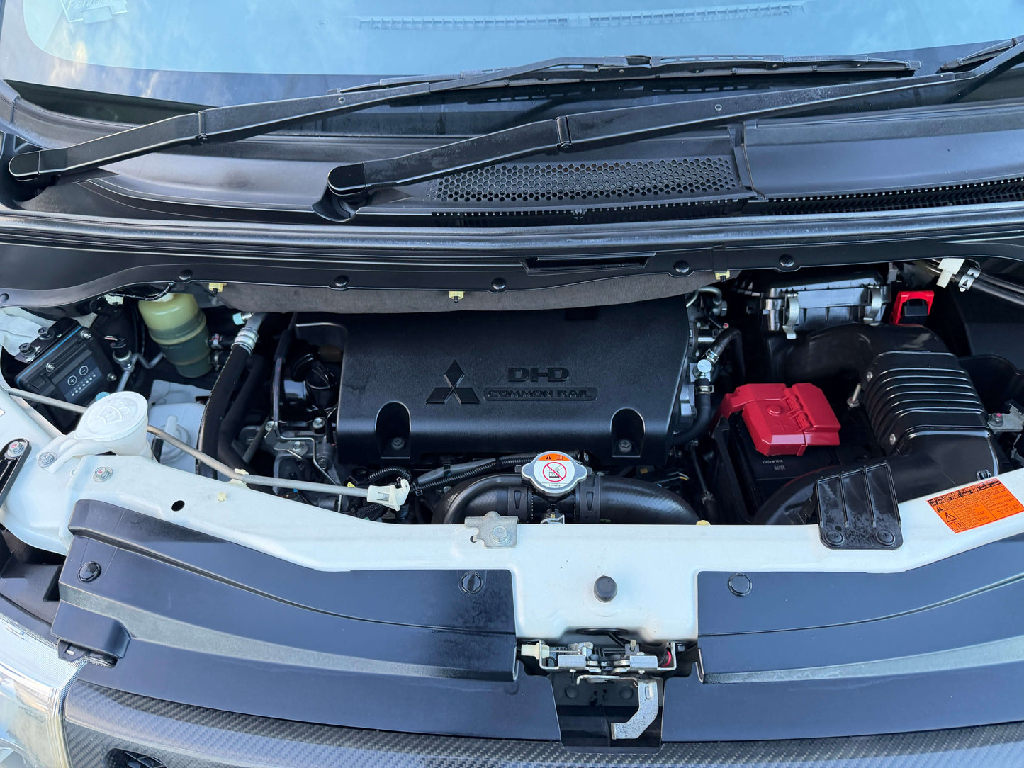 Engine view of 2017 Mitsubishi Delica D5 2.3 Diesel-Turbo 4WD with modern components and design.