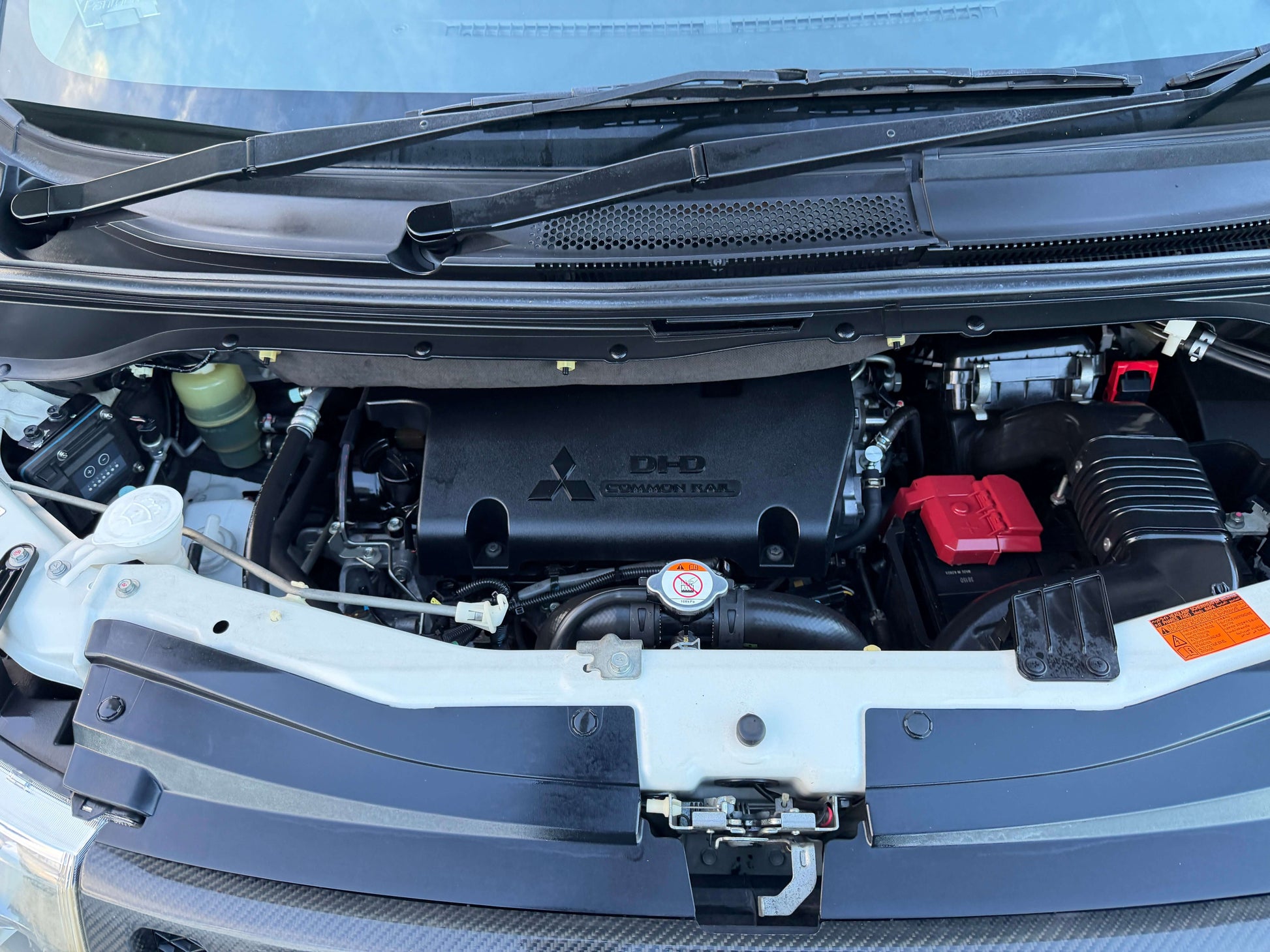 Engine view of 2017 Mitsubishi Delica D5 2.3 Diesel-Turbo 4WD with modern components and design.