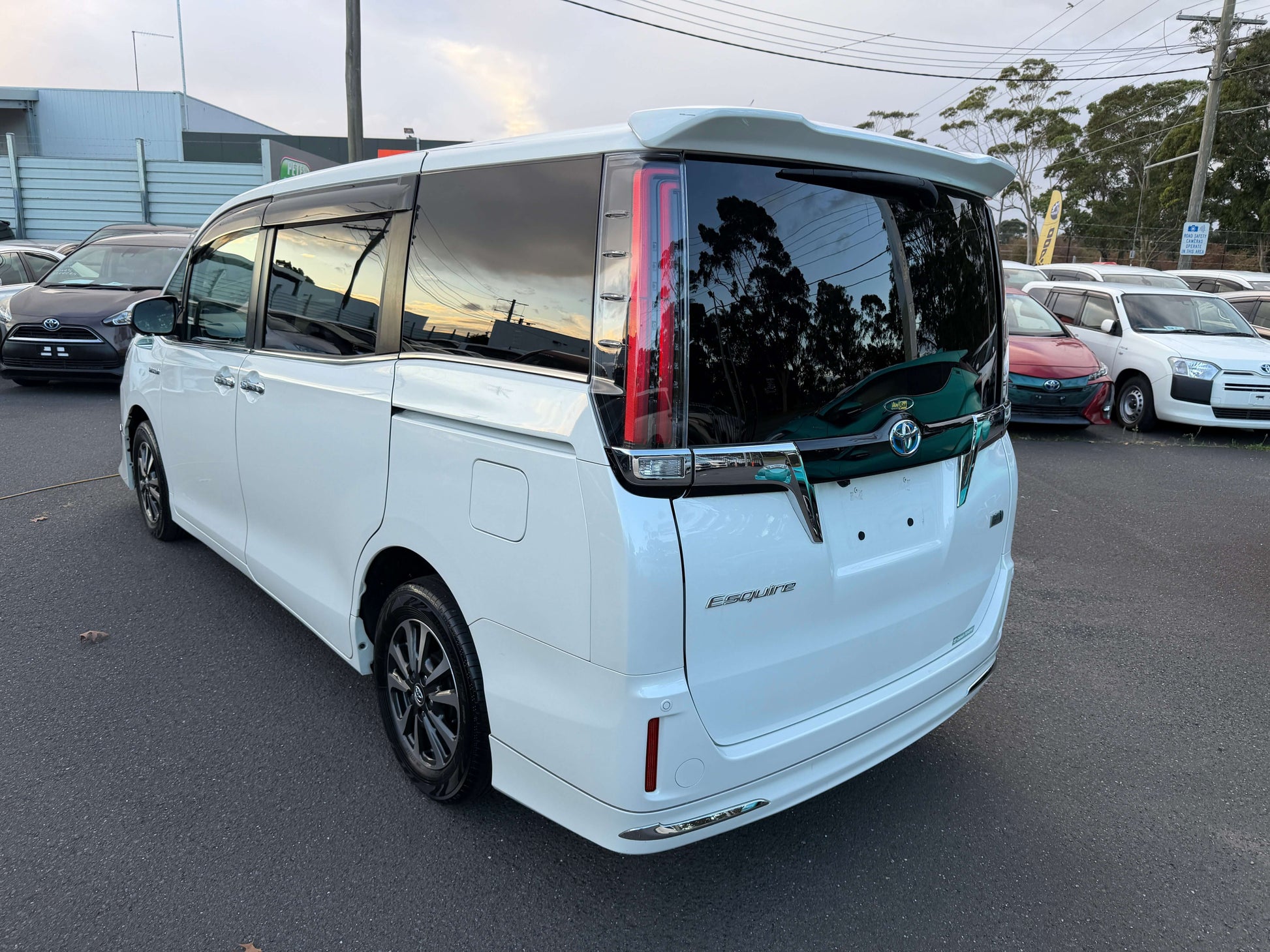 2018 Toyota Esquire 1.8L Hybrid rear view showcasing premium features and spacious design in white color.