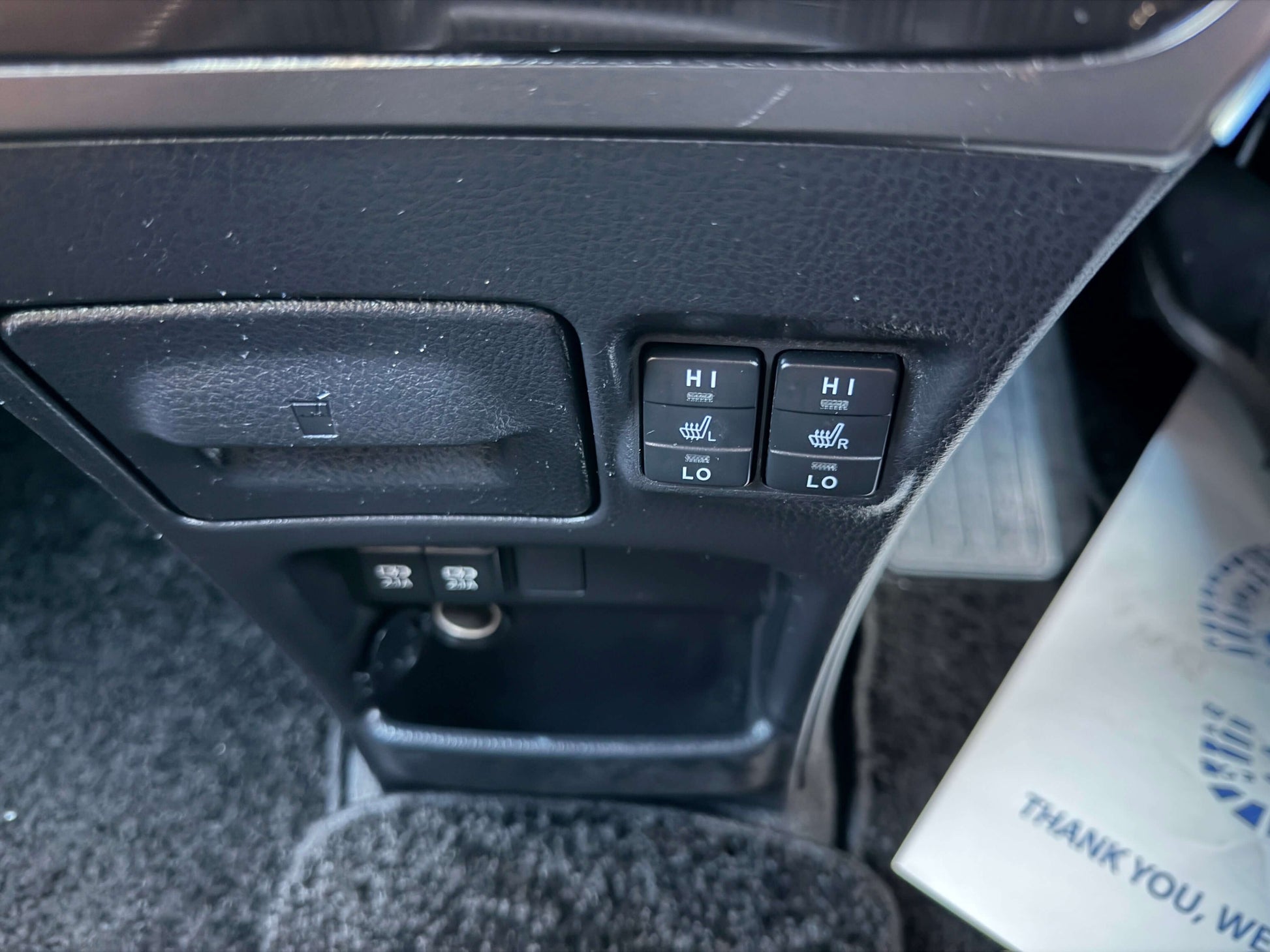 Interior controls for seat heating in a 2018 Toyota Esquire 1.8L Hybrid Gi Premium, showcasing high and low settings.