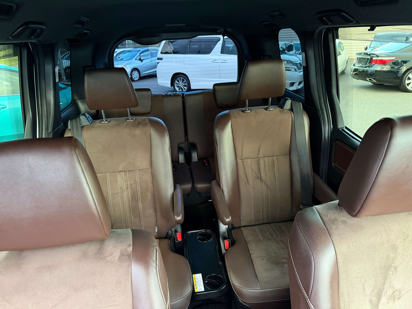Interior view of a 2018 Toyota Esquire 1.8L Hybrid Gi Premium Package with brown leather seats.