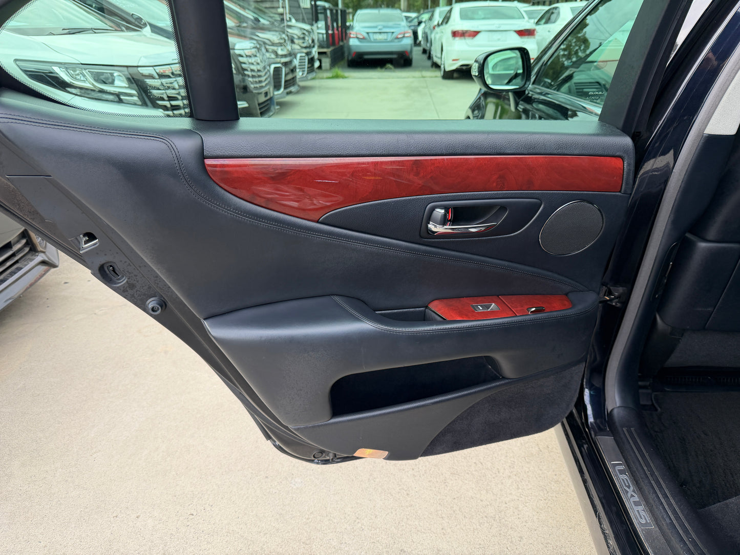 2007 Lexus LS600h AWD V8 5.0L Hybrid rear passenger cabin view from right side showing leather seats and centre armrest