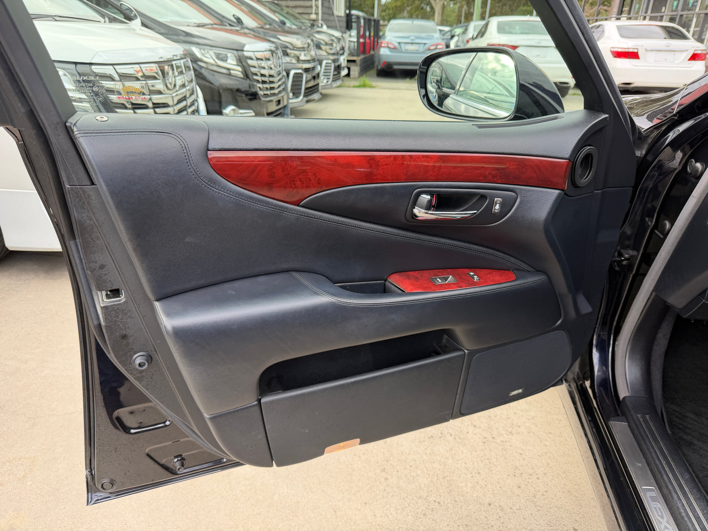2007 Lexus LS600h AWD V8 5.0L Hybrid interior view from passenger side showing front seats, dashboard and centre console