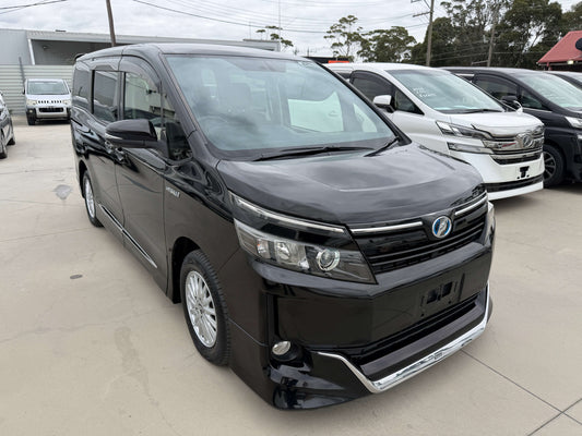 2015 Toyota Voxy 1.8L Hybrid V Premium Edition black people mover front three-quarter view