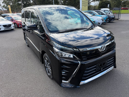 2017 Toyota Voxy 2.0L ZS Premium Edition black people mover front three-quarter view showing ZS front fascia and chrome lower bar