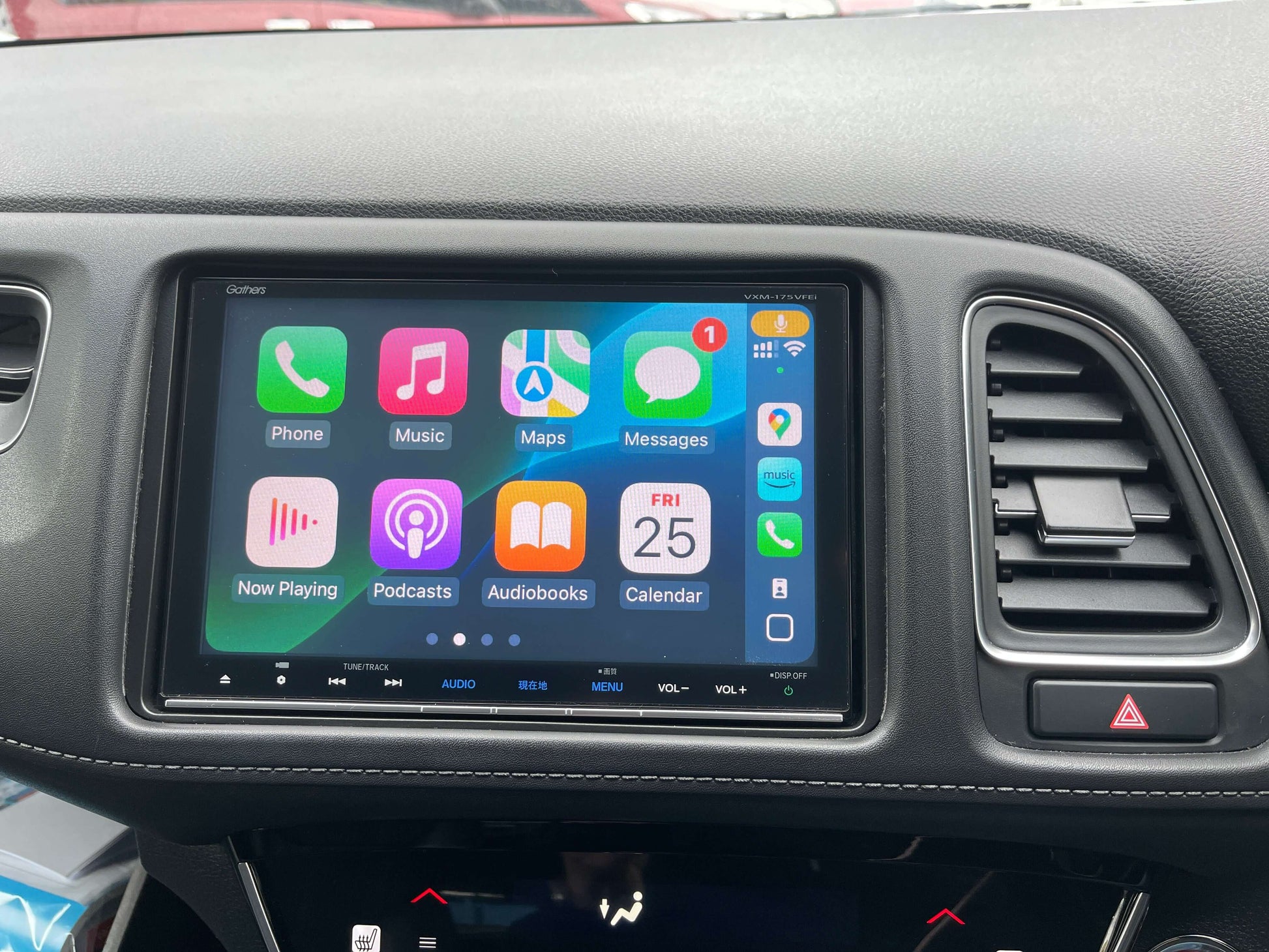 Interior display of 2016 Honda Vezel HR-V Hybrid featuring navigation and media controls.