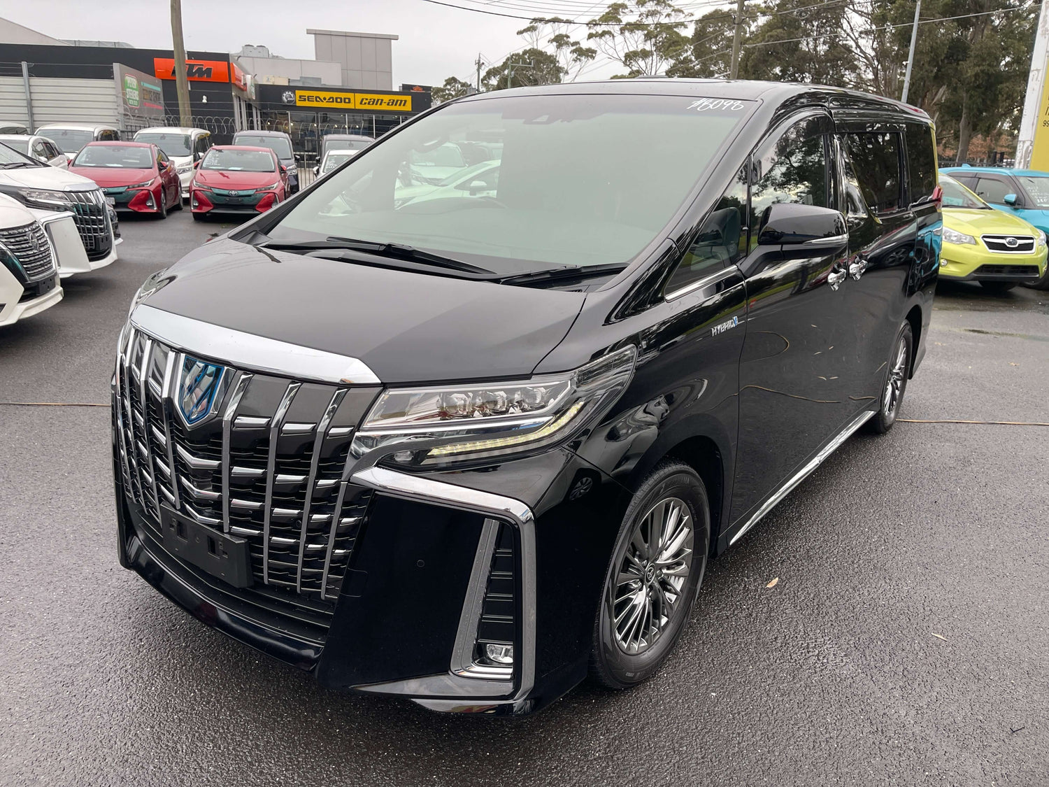 2019 Toyota Alphard 2.5L e-Four Hybrid Executive Lounge black luxury people mover in parking lot.