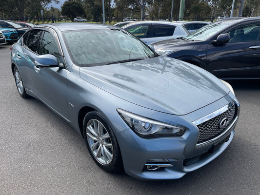 2016 Nissan Skyline V6 3.5L Hybrid displayed in silver color with sleek design and shiny alloy wheels.