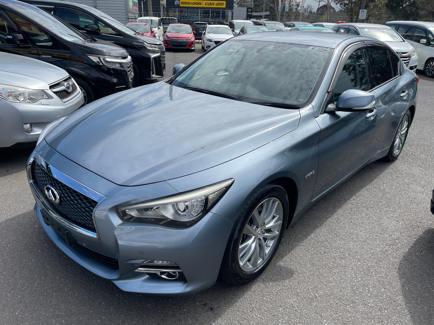 2016 Nissan Skyline V6 3.5L Hybrid 350GT Sport Sedan in blue parked among other vehicles