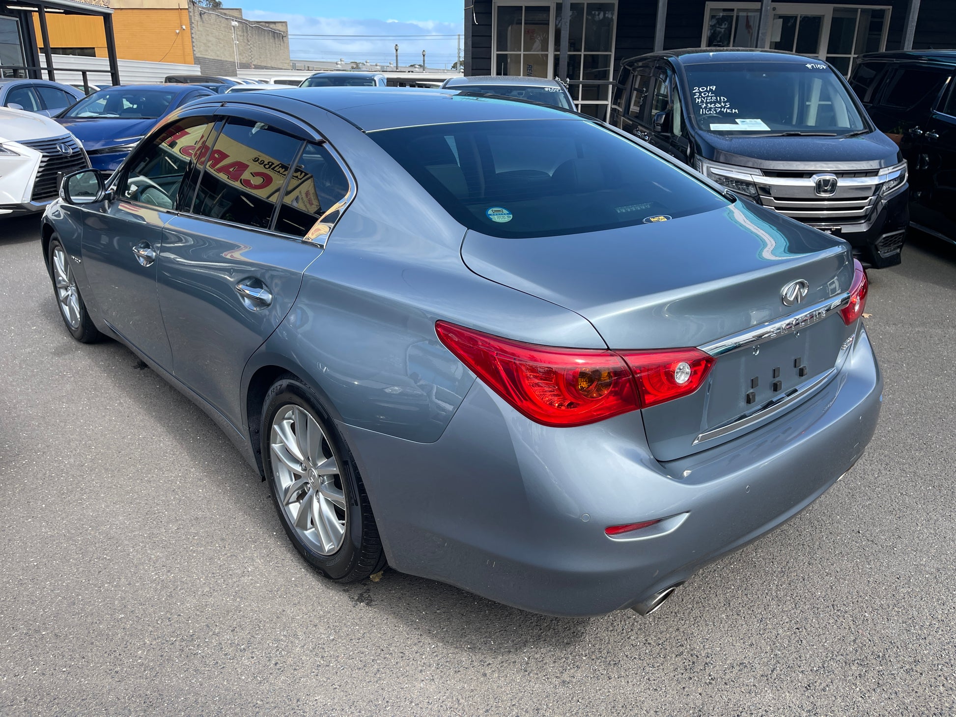 2016 Nissan Skyline V6 3.5L Hybrid 350GT Sport Sedan in gray color, showcasing rear view and sleek design.