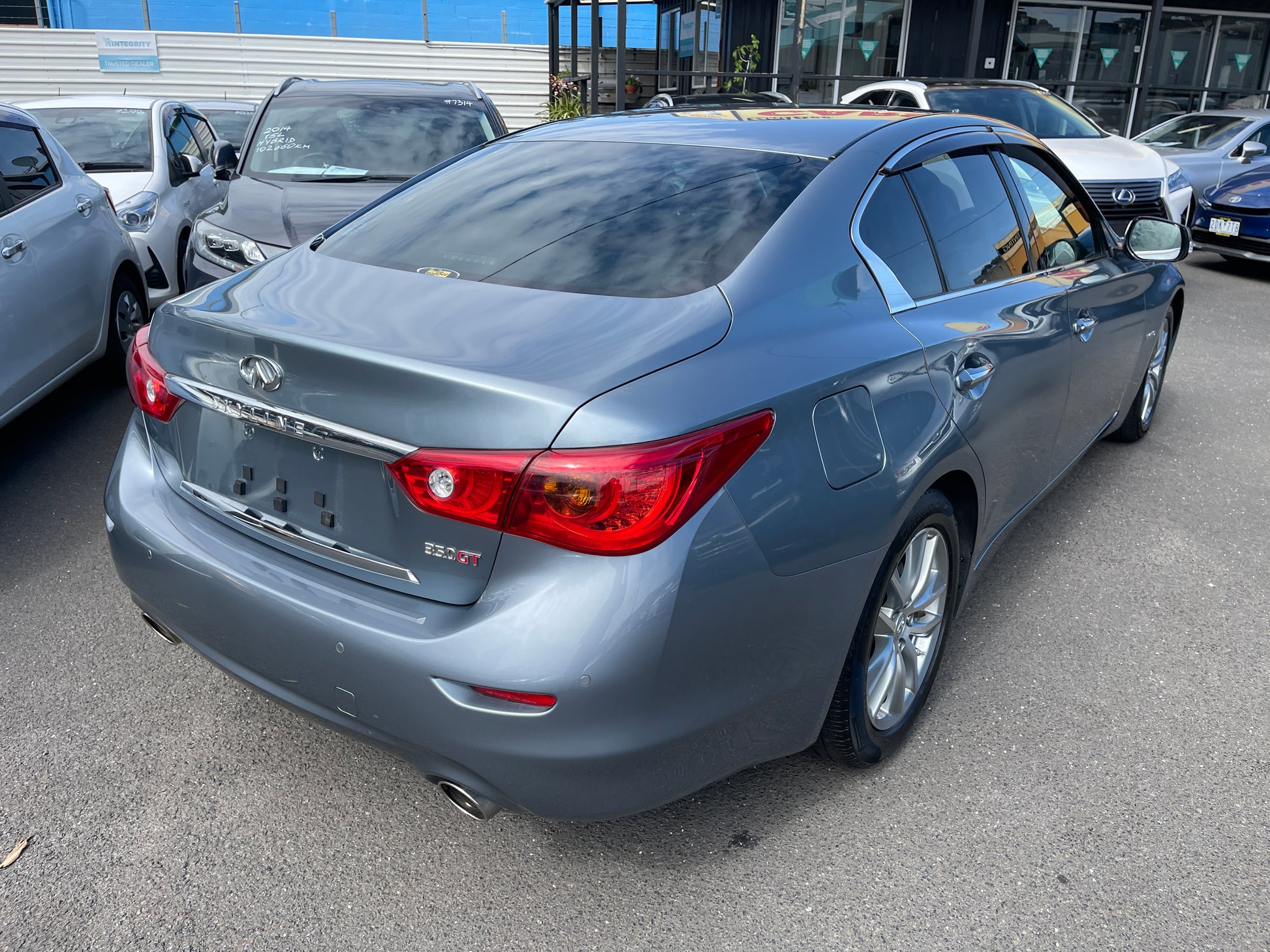 2016 Nissan Skyline V6 3.5L Hybrid 350GT SP Version Sport Sedan in gray rear view, showcasing sleek design and modern features.