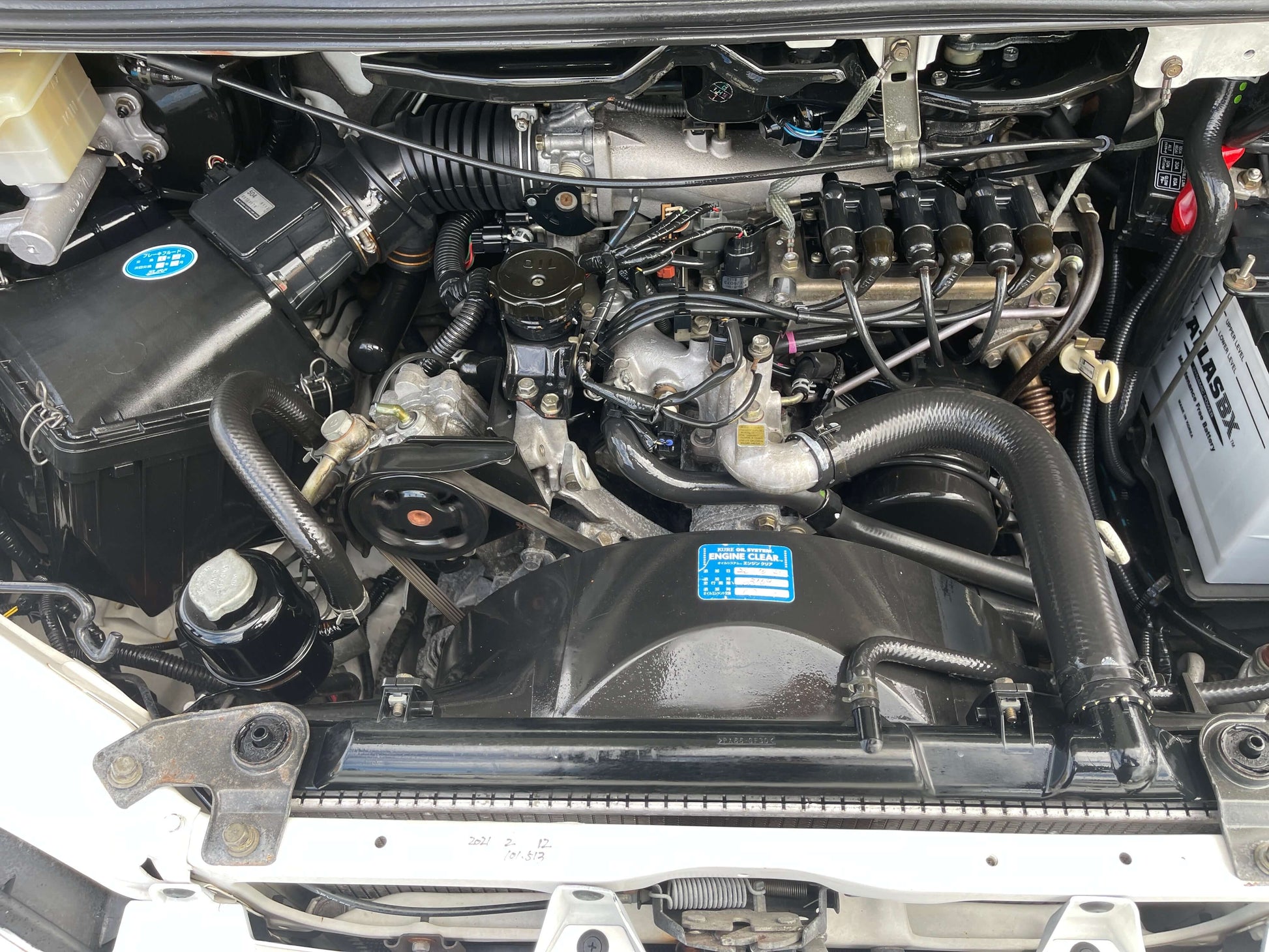 2006 Mitsubishi Delica engine compartment showing V6 3.0L 4WD components and parts.