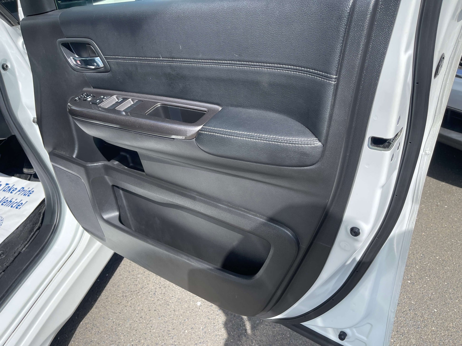 Interior view of the door panel of a 2018 Honda Stepwgn 2.0 Spada Hybrid G Honda Sensing showcasing controls.