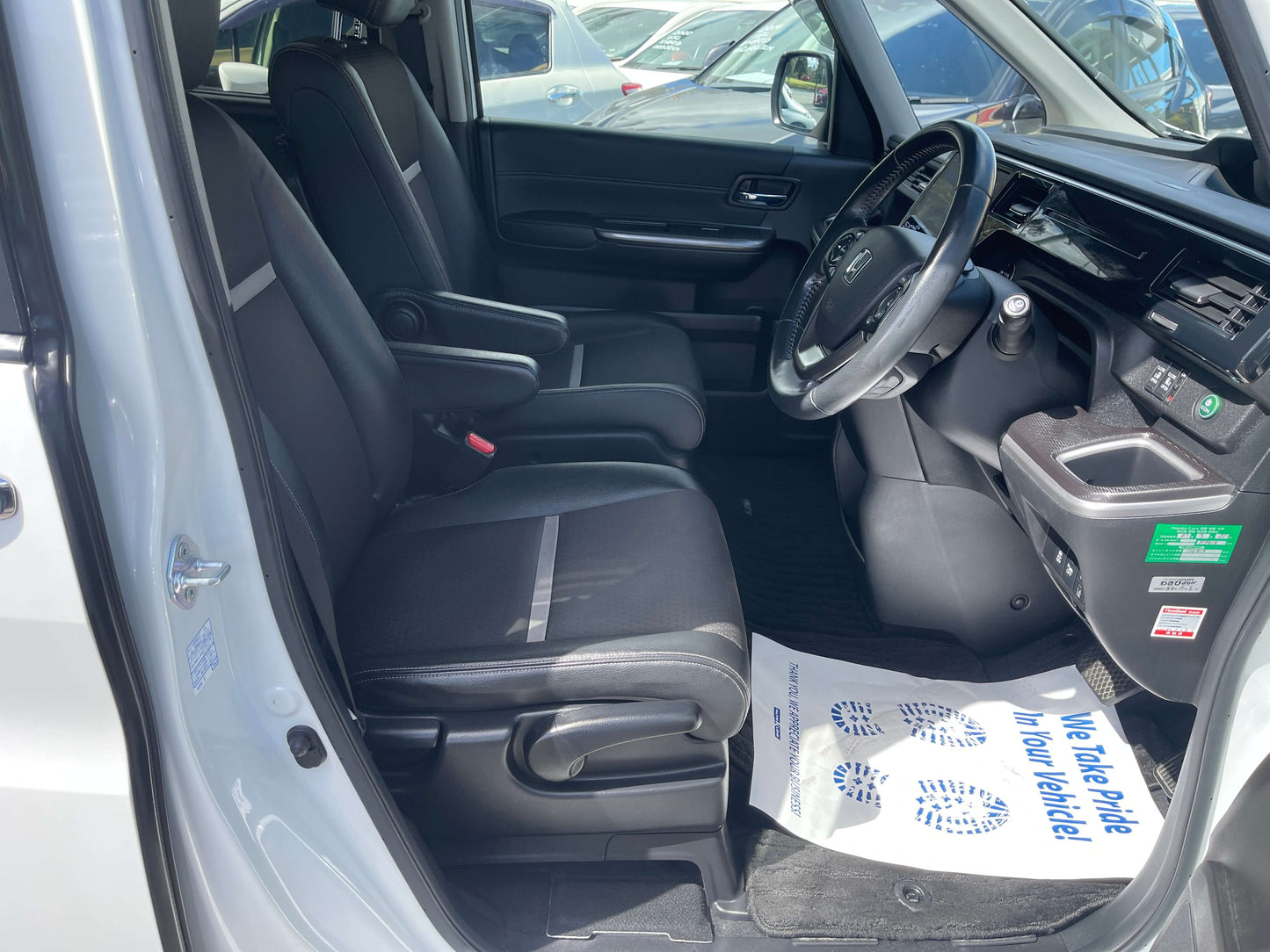Interior view of the 2018 Honda Stepwgn 2.0 Spada Hybrid showing driver's seat and dashboard.