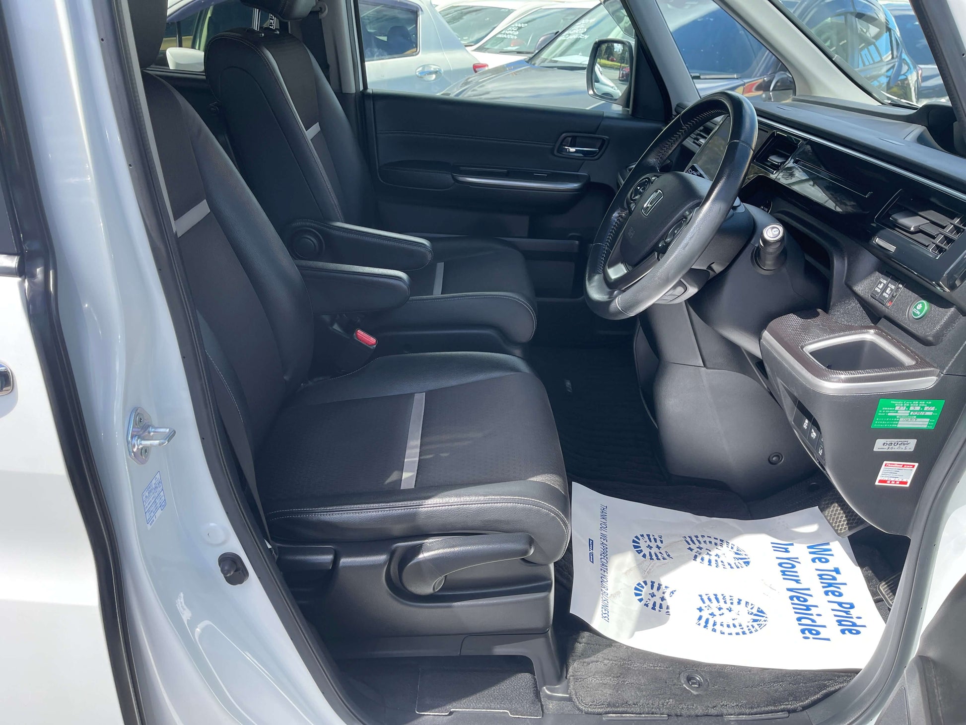 Interior view of the 2018 Honda Stepwgn 2.0 Spada Hybrid showing driver's seat and dashboard.