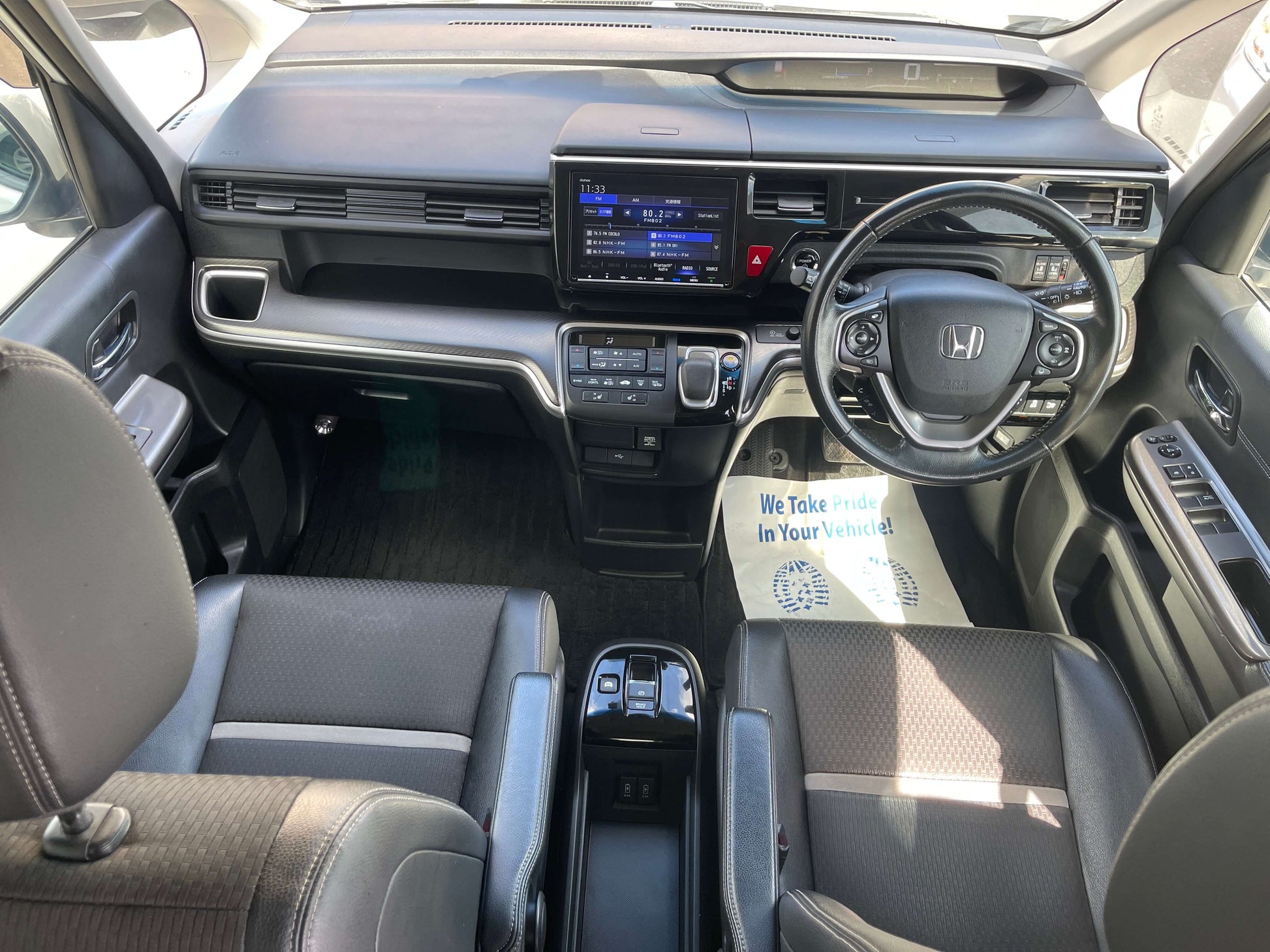 Interior view of 2018 Honda Stepwgn 2.0 Spada Hybrid G Honda Sensing showing dashboard and seats.