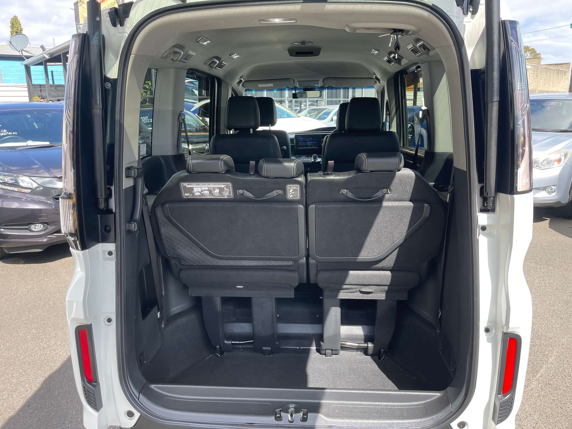 Interior view of the 2018 Honda Stepwgn 2.0 Spada Hybrid with spacious rear seating and cargo area.