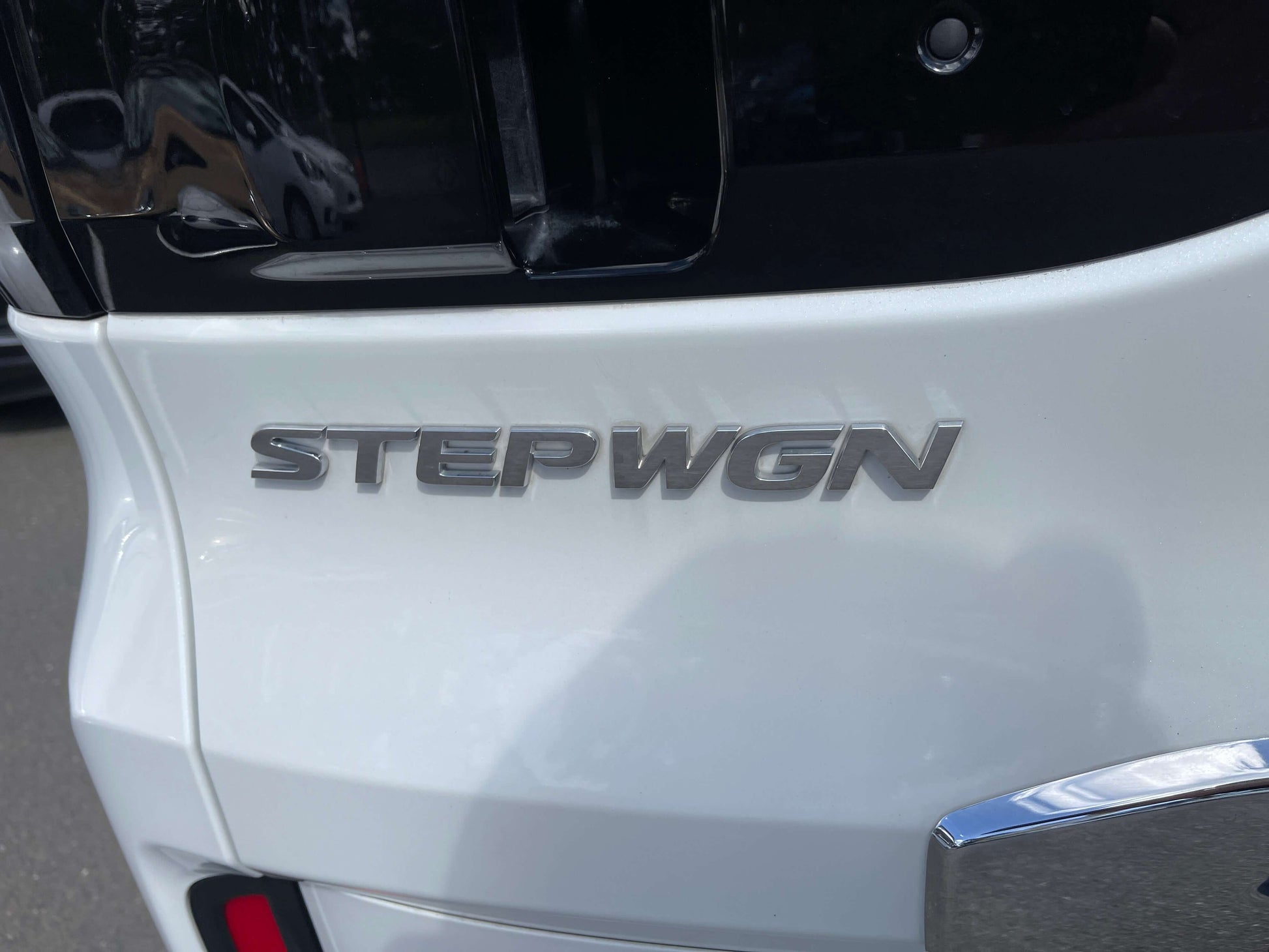 Rear emblem of 2018 Honda Stepwgn 2.0 Spada Hybrid displaying the word 'STEPWGN' in silver lettering.