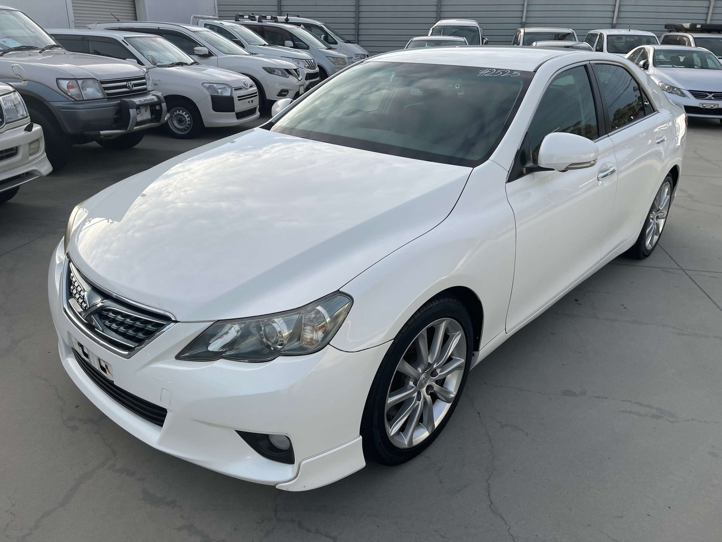 2011 Toyota Mark X V6 3.5L 350S Sport Sedan in white parked among other vehicles
