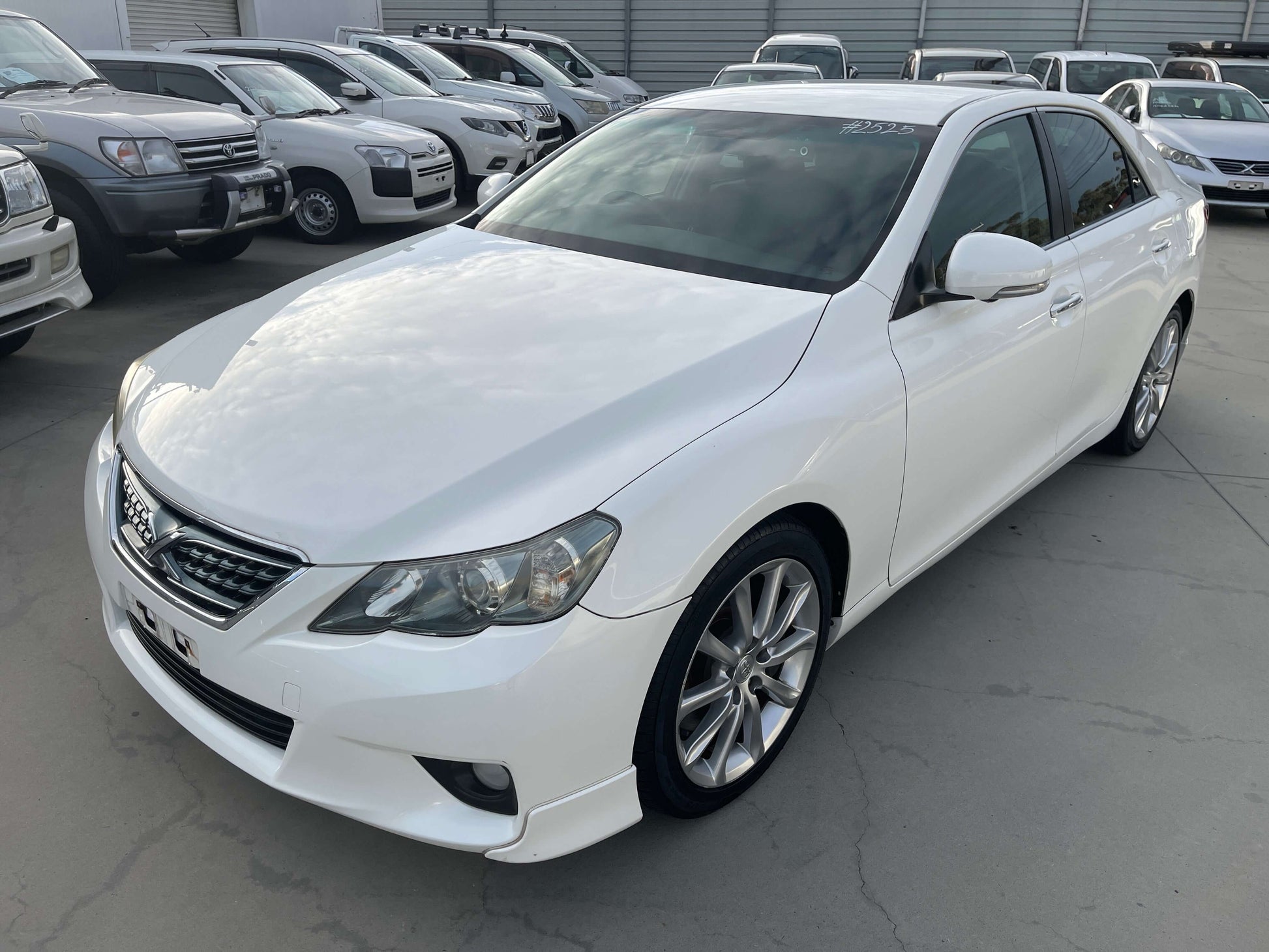 2011 Toyota Mark X V6 3.5L 350S Sport Sedan in white parked among other vehicles