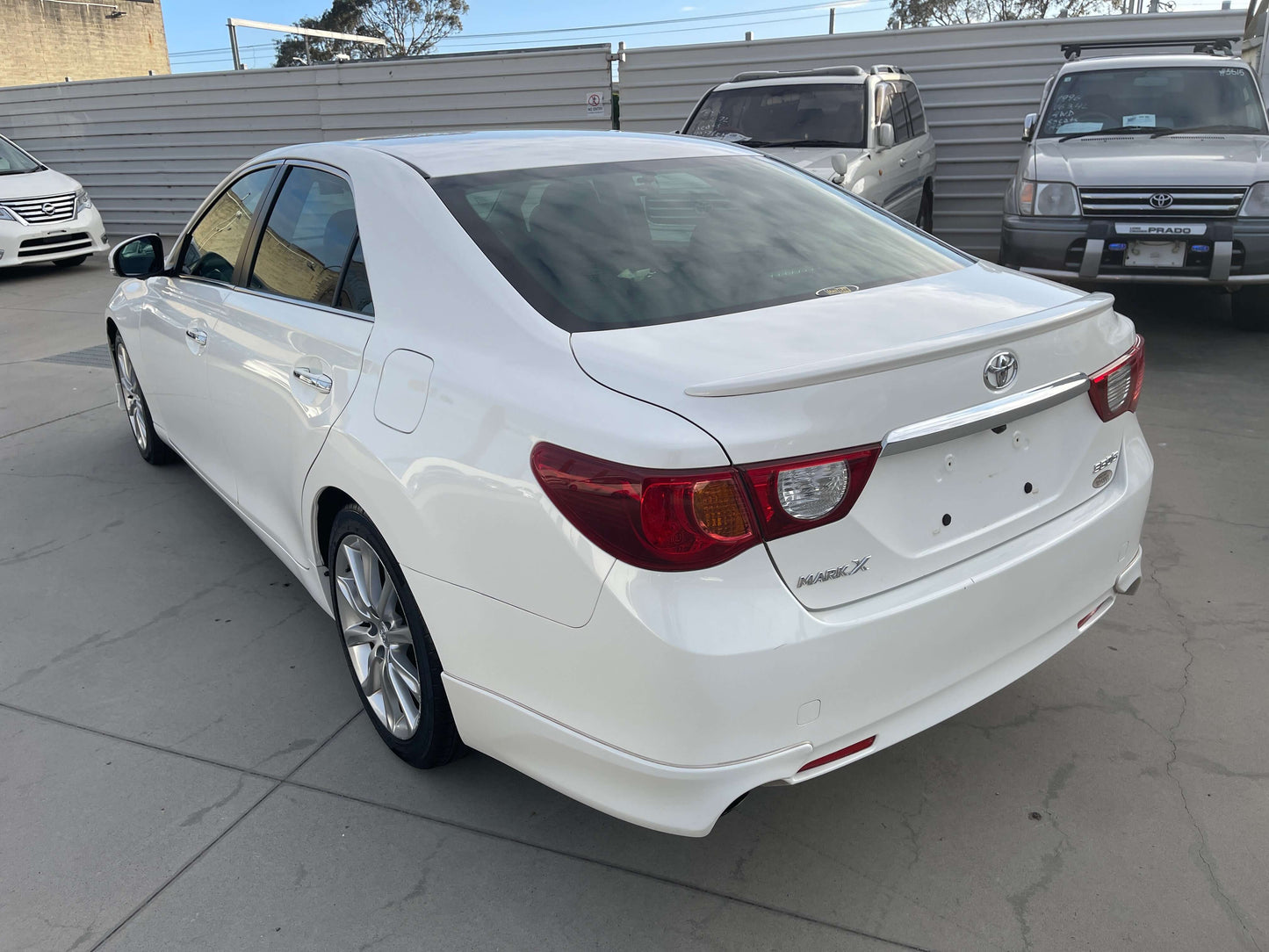 2011 Toyota Mark X V6 3.5L 350S Sport Sedan white rear view in a parking lot