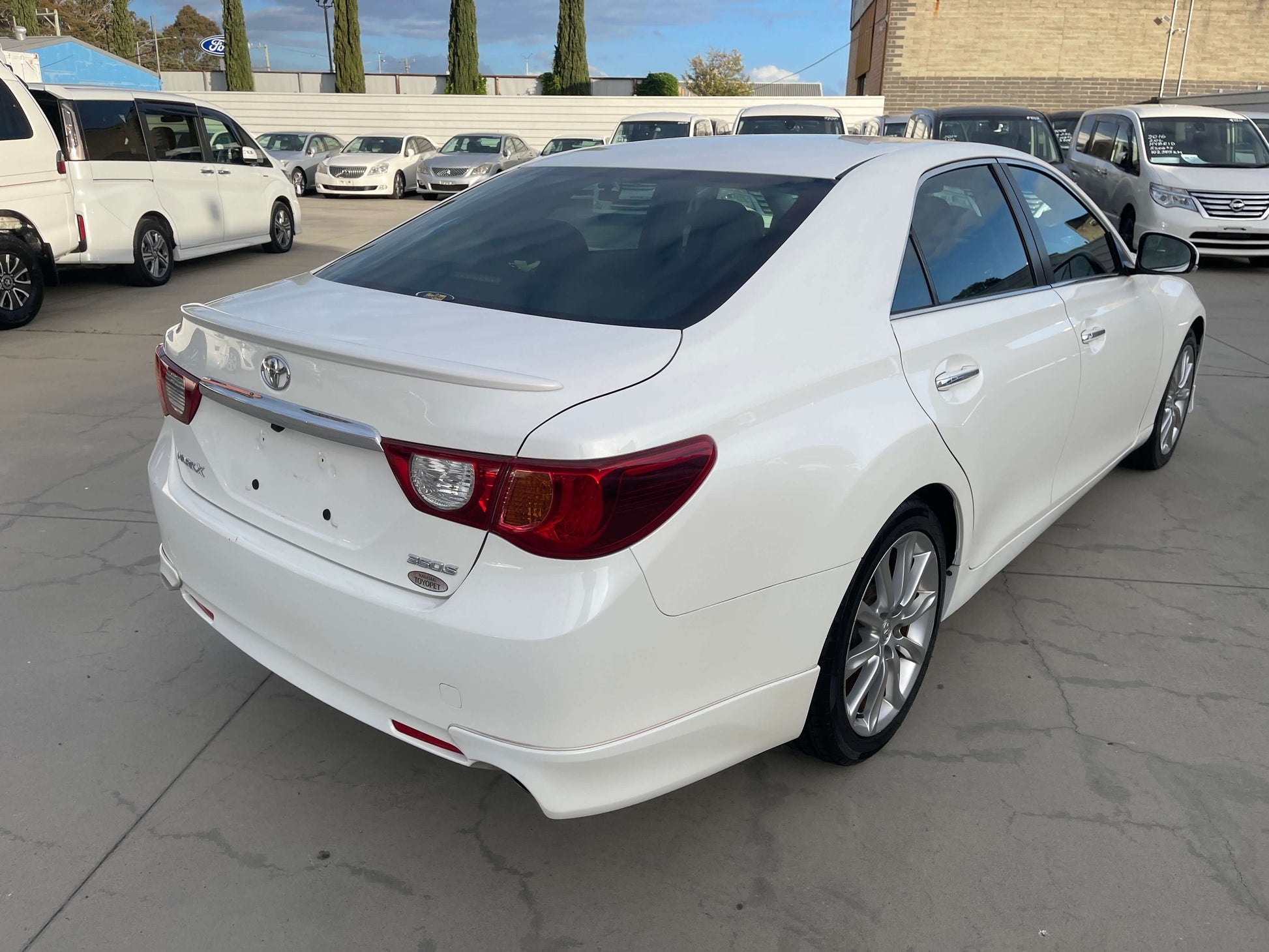 2011 Toyota Mark X V6 3.5L 350S Sport Sedan rear view showcasing its sleek design and luxury features.