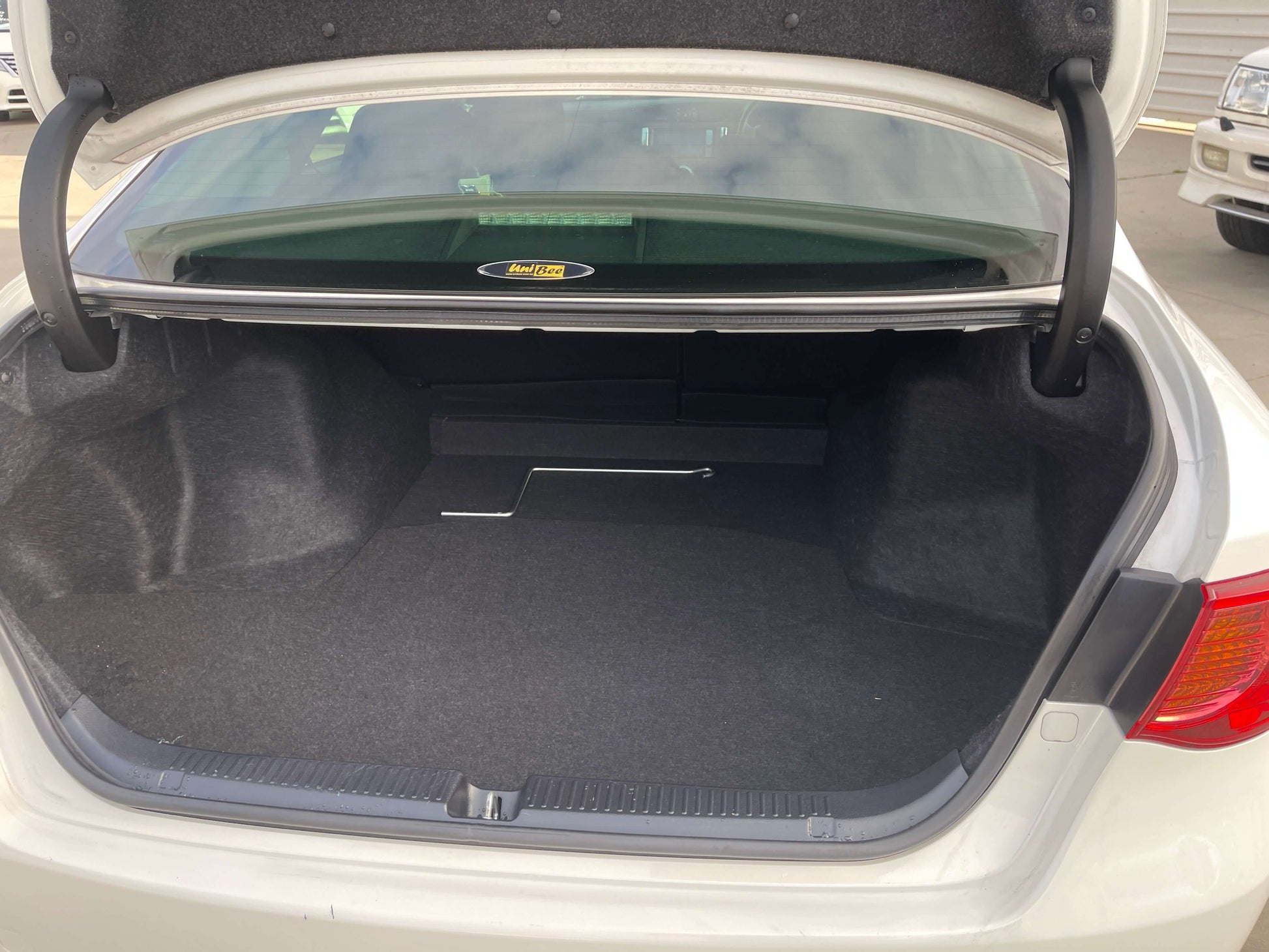 2011 Toyota Mark X trunk space showing ample storage room with clean interior finish.