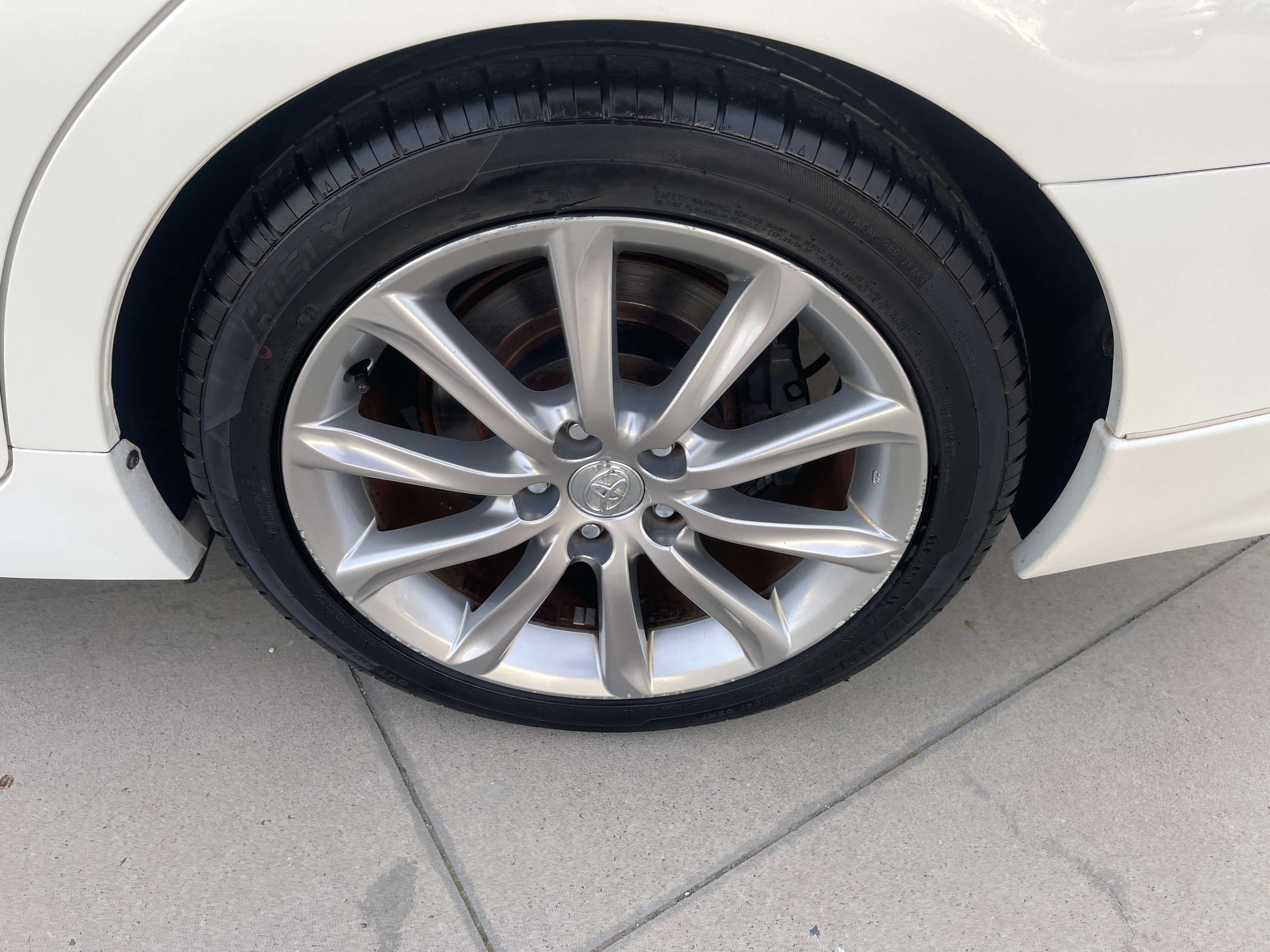 Close-up of the alloy wheel and tire of a 2011 Toyota Mark X V6 3.5L 350S Sport Sedan.