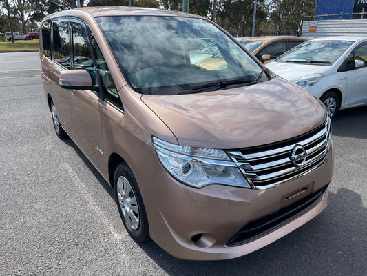 2016 Nissan Serena 2.0L S-Hybrid Highway Star in a light color parked on a showroom lot