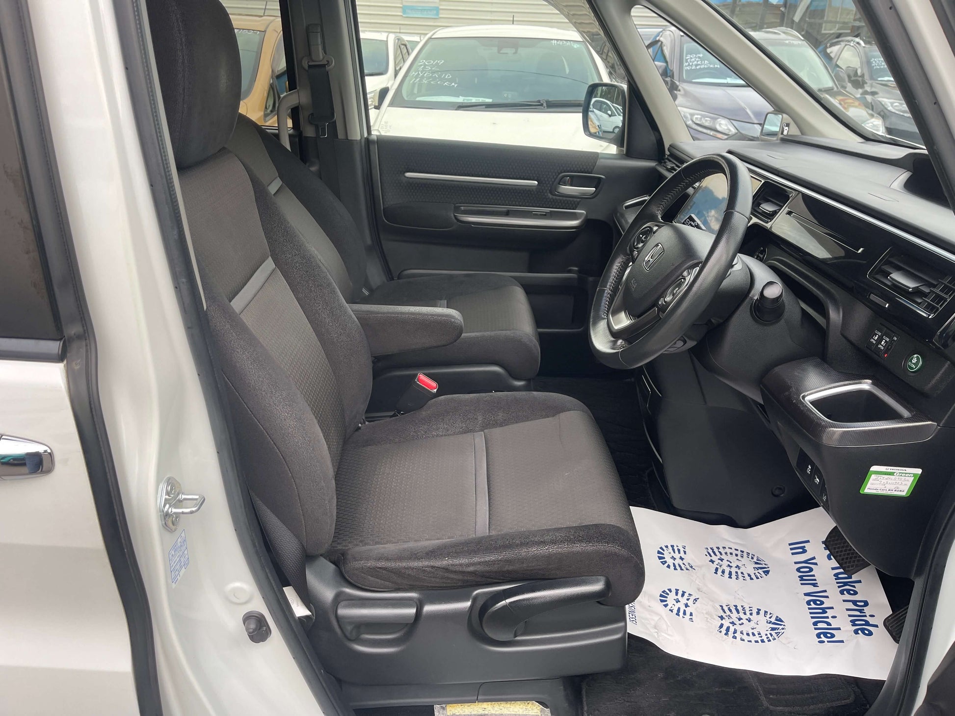 Interior view of 2018 Honda Honda Stepwgn 2.0 Spada Hybrid G Honda Sensing showcasing spacious seating and dashboard.