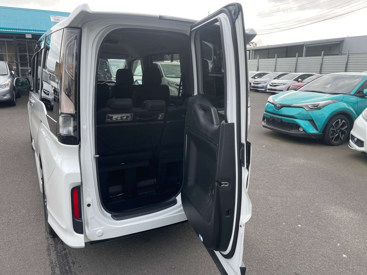 Interior view of the 2018 Honda Honda Stepwgn 2.0 Spada Hybrid G Honda Sensing showcasing spacious seating and access.