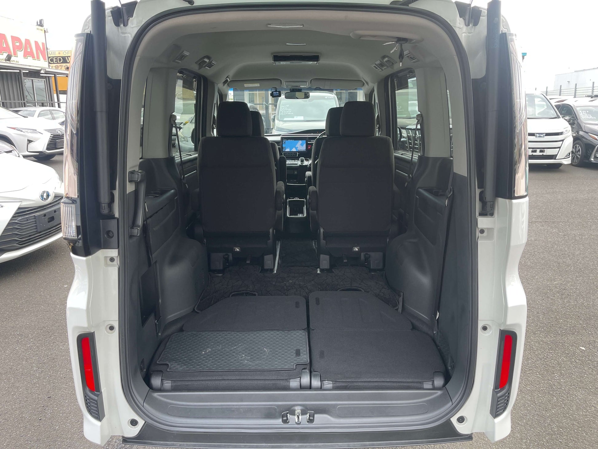 Interior view of the 2018 Honda Honda Stepwgn 2.0 Spada Hybrid G Honda Sensing, showcasing spacious seating for 7.