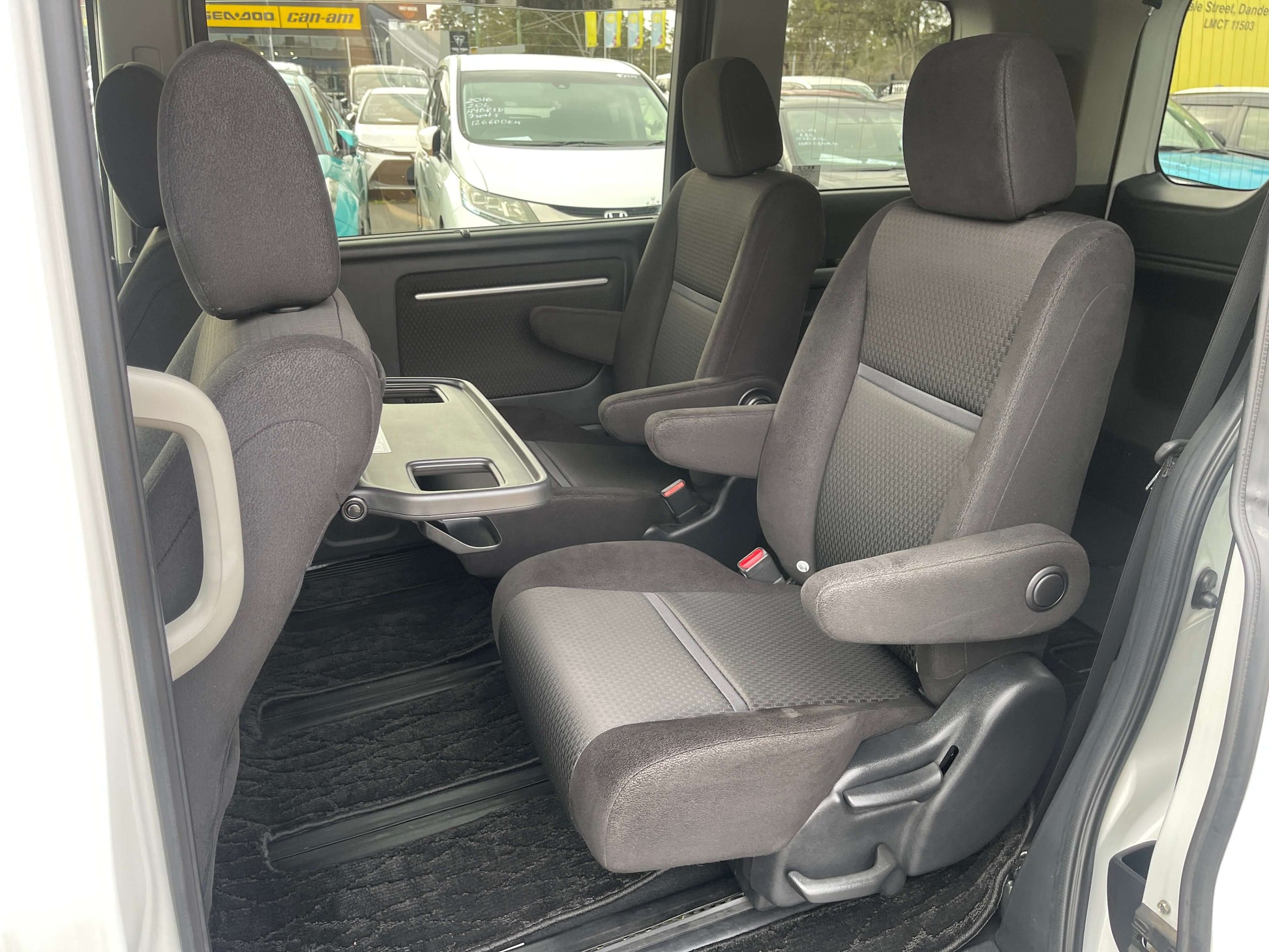 Interior view of 2018 Honda Honda Stepwgn 2.0 Spada Hybrid G Honda Sensing showing spacious seating for 7 with comfort features.