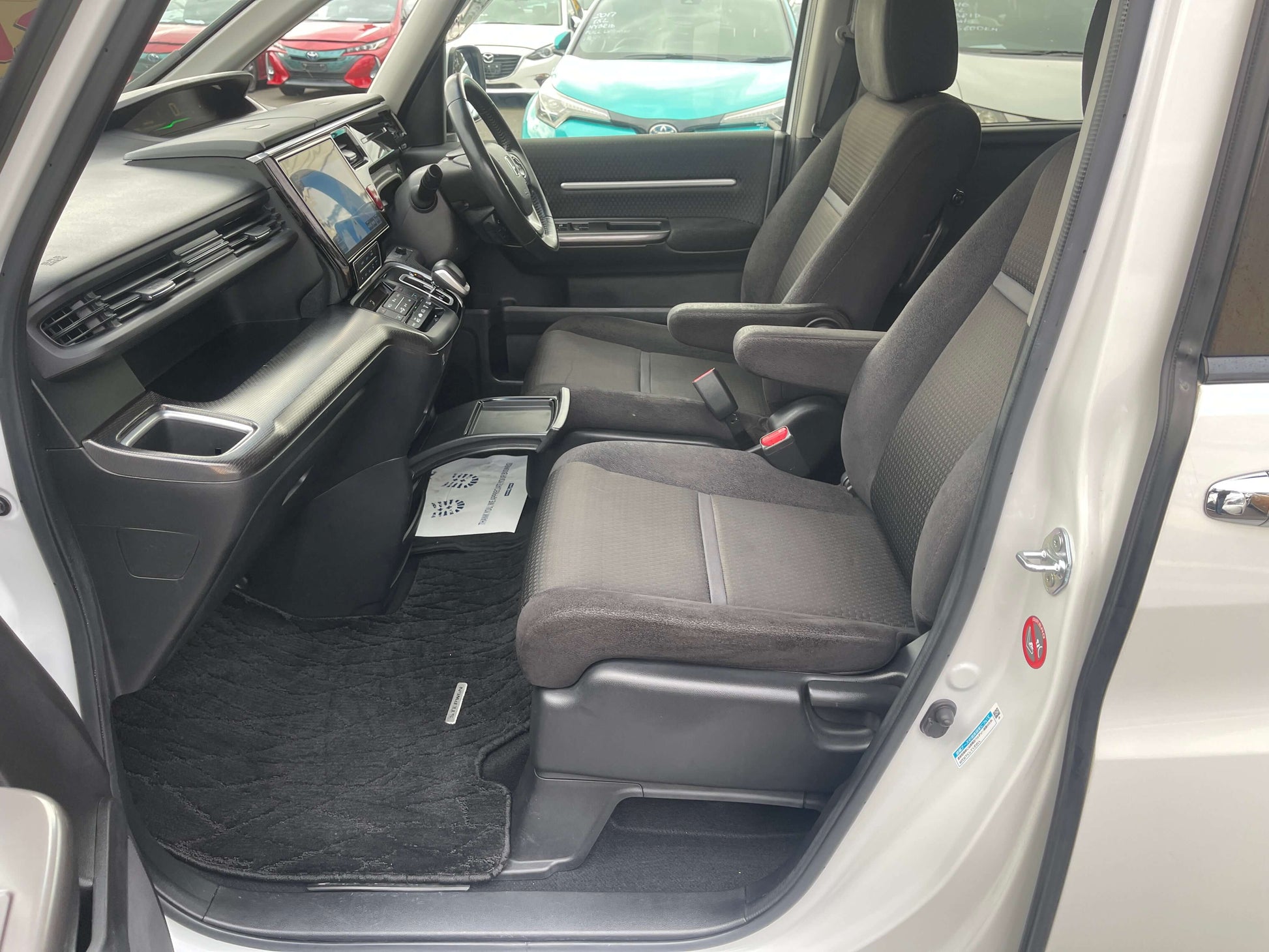 Interior view of the 2018 Honda Honda Stepwgn 2.0 Spada Hybrid G Honda Sensing showing spacious seating and dashboard.