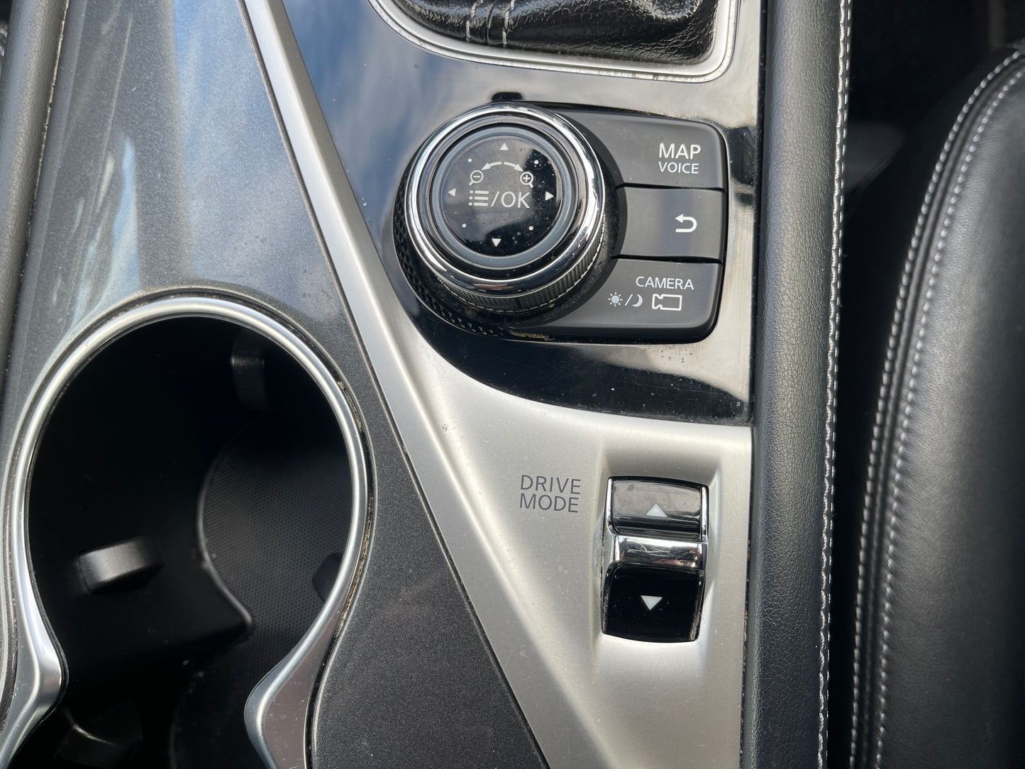 Interior controls of a 2016 Nissan Skyline V6 3.5L Hybrid 350GT featuring map, camera, and drive mode settings.