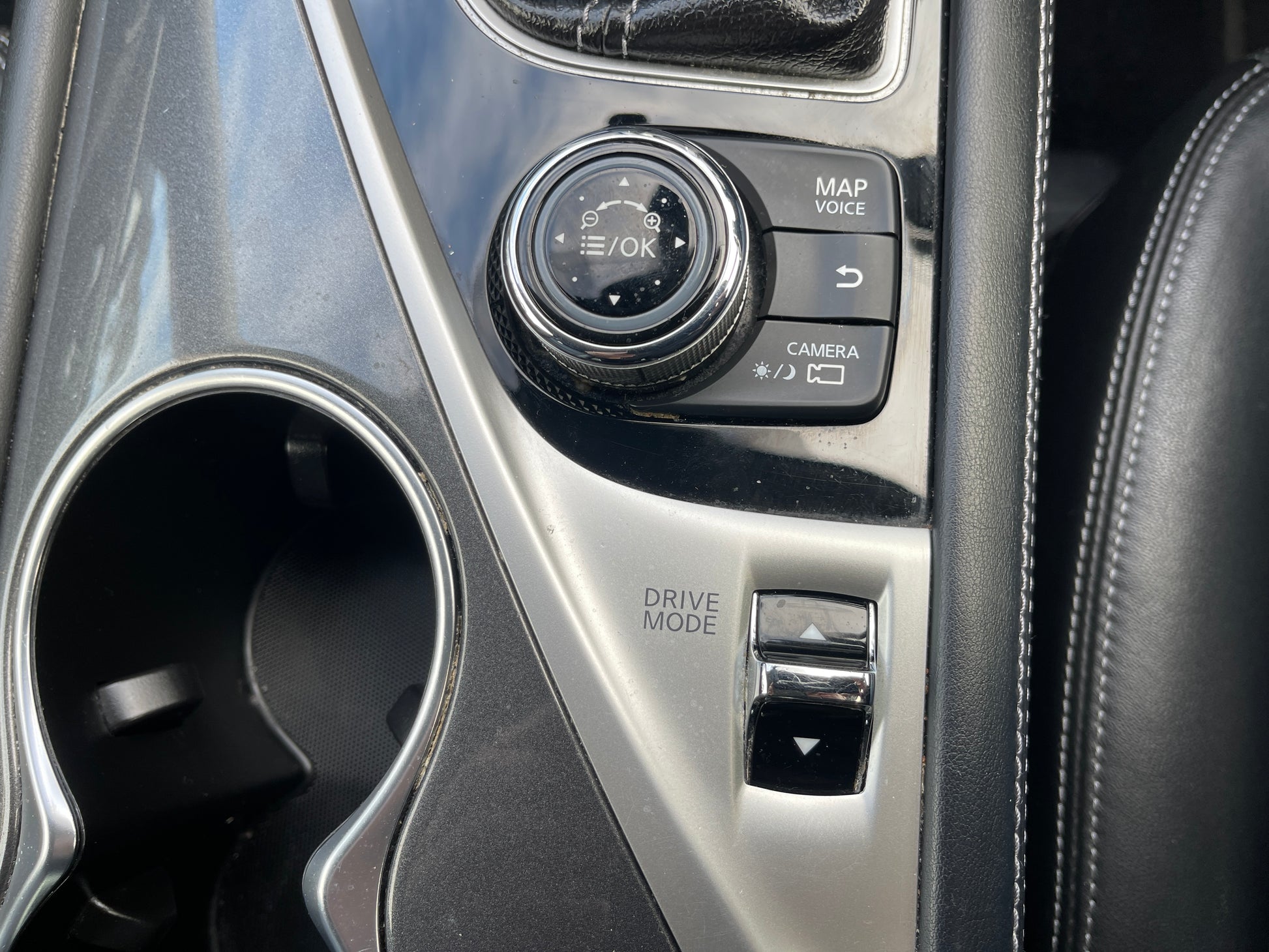 Interior controls of a 2016 Nissan Skyline V6 3.5L Hybrid 350GT featuring map, camera, and drive mode settings.