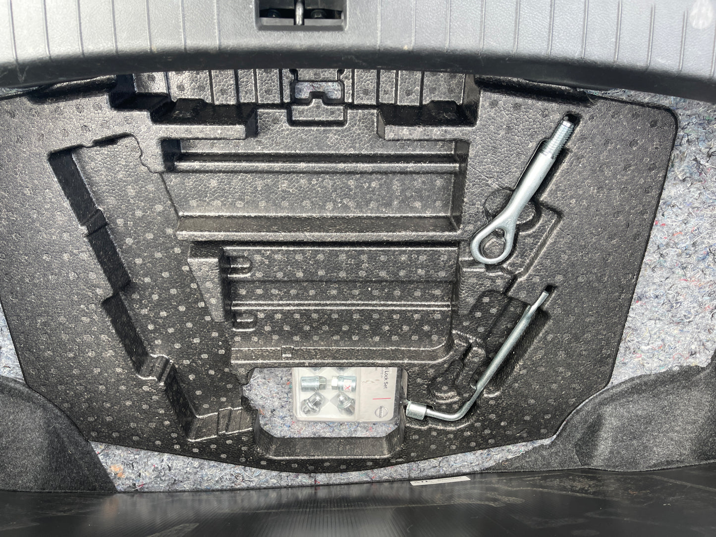 Storage compartment with tools and equipment for the 2016 Nissan Skyline V6 3.5L Hybrid 350GT Sport Sedan.