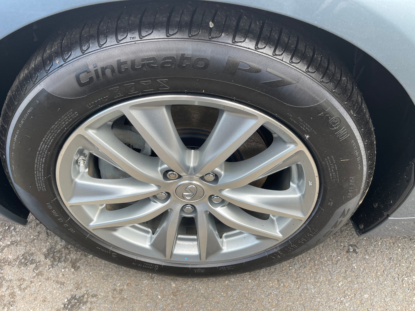 Close-up of 2016 Nissan Skyline V6 3.5L Hybrid wheel with Cinturato P7 tire, showcasing alloy rim design.
