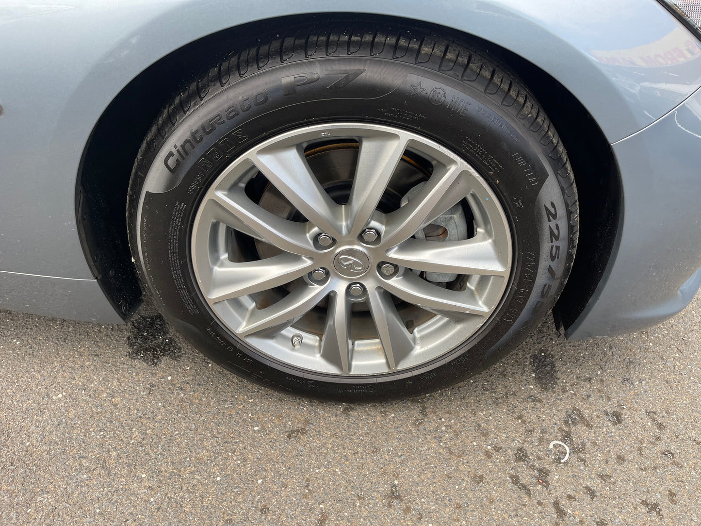2016 Nissan Skyline V6 3.5L Hybrid wheel and tire close-up showing sport design and details.