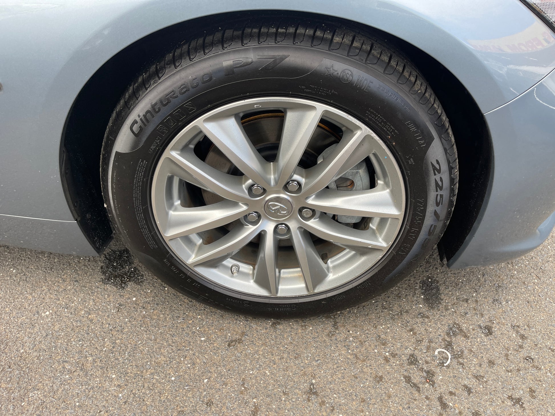 2016 Nissan Skyline V6 3.5L Hybrid wheel and tire close-up showing sport design and details.