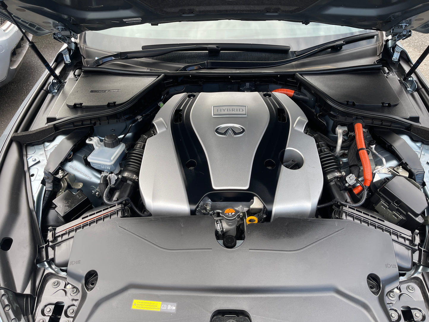 Engine view of 2016 Nissan Skyline V6 3.5L Hybrid showcasing powerful performance features.
