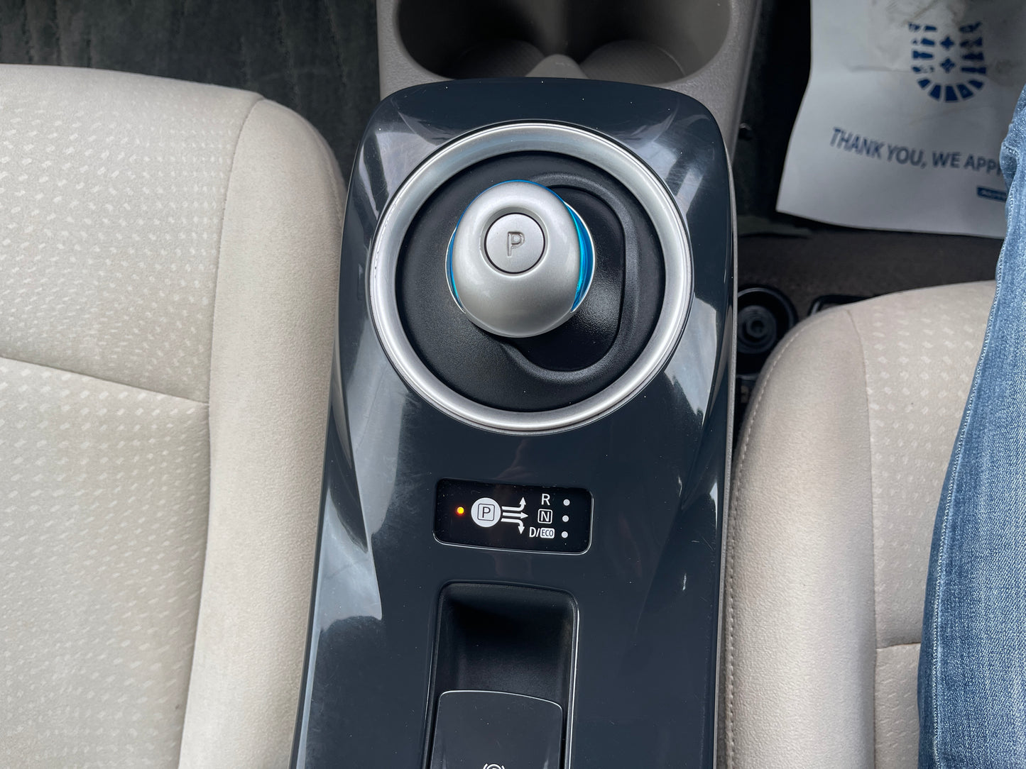 Interior view of the 2013 Nissan Leaf 24kW G-Edition Full Electric showing gear shift and control buttons.