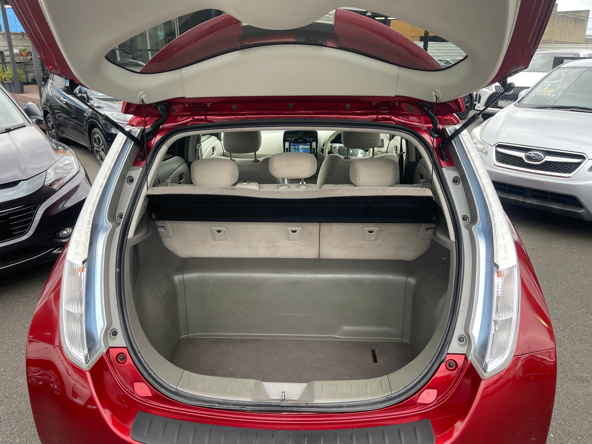 Interior view of 2013 Nissan Leaf 24kW G-Edition Full Electric trunk space with seats folded.