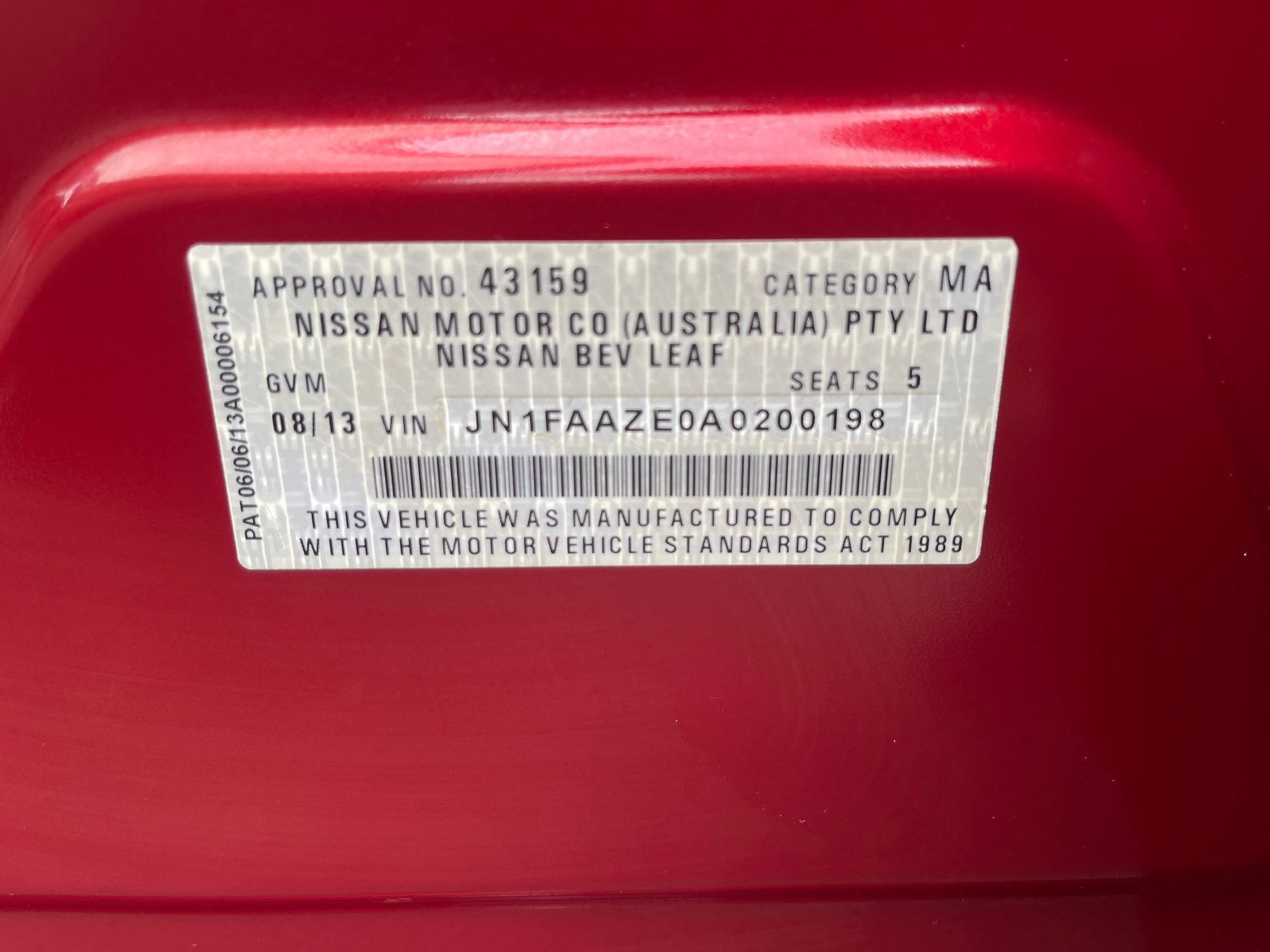 2013 Nissan Leaf 24kW G-Edition Full Electric VIN label showing approval and specifications.