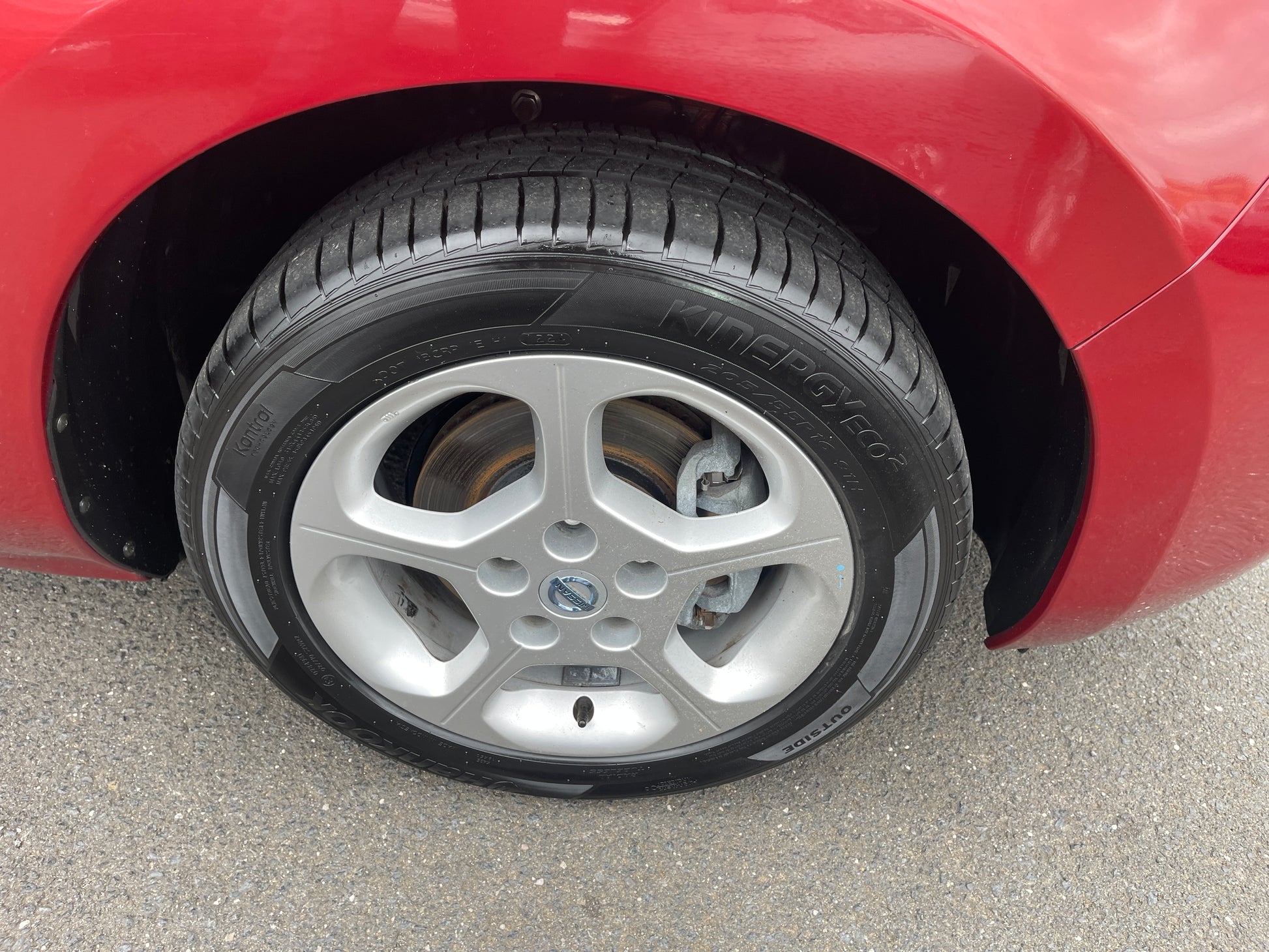 2013 Nissan Leaf 24kW G-Edition Full Electric wheel close-up with silver alloy rim and tire.