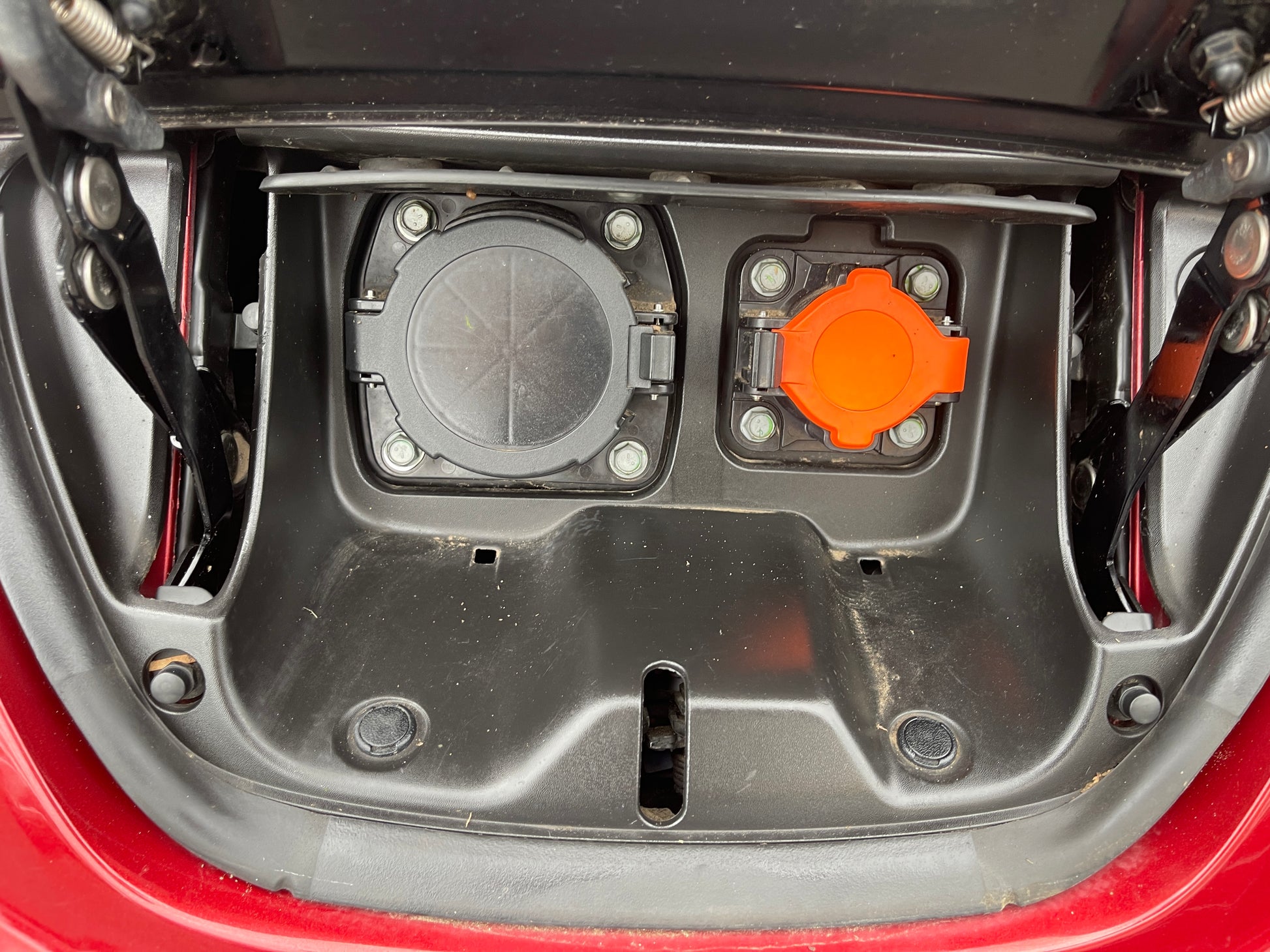 Charging port compartment of a 2013 Nissan Leaf 24kW G-Edition Full Electric.