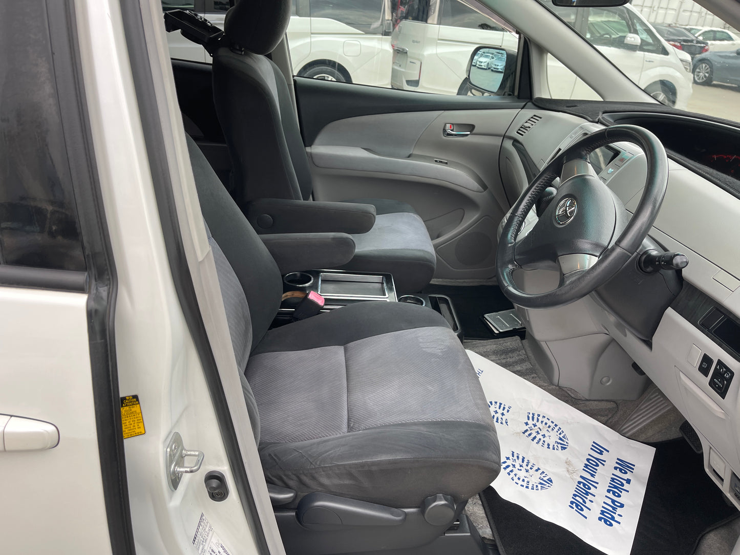 Interior view of 2006 Toyota Estima Aeras V6 3.5L showing spacious seating and driver dashboard.